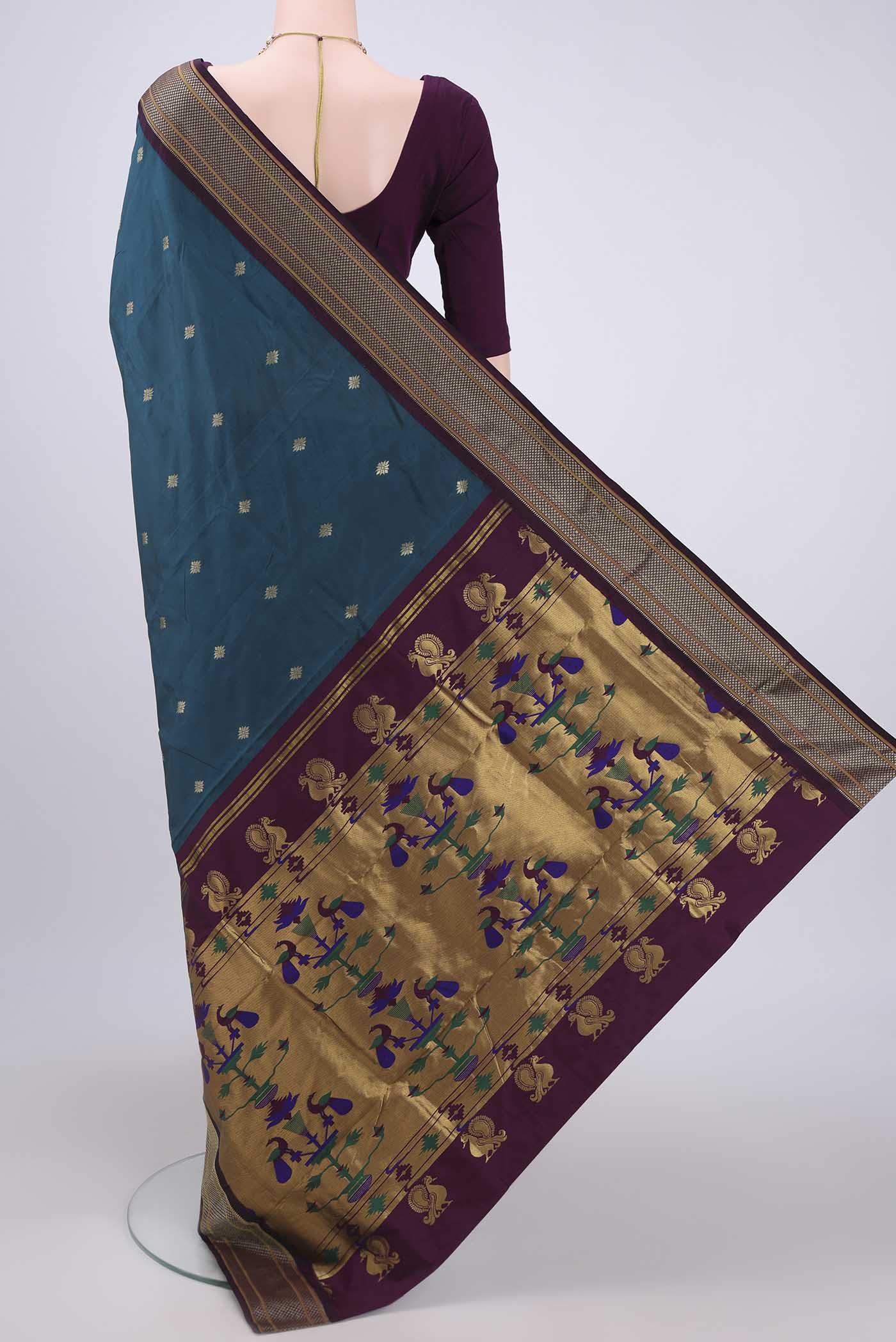 Flat view of Green Blended Bangalore Silk Saree with Zari Butta on the body and Zari Border. 