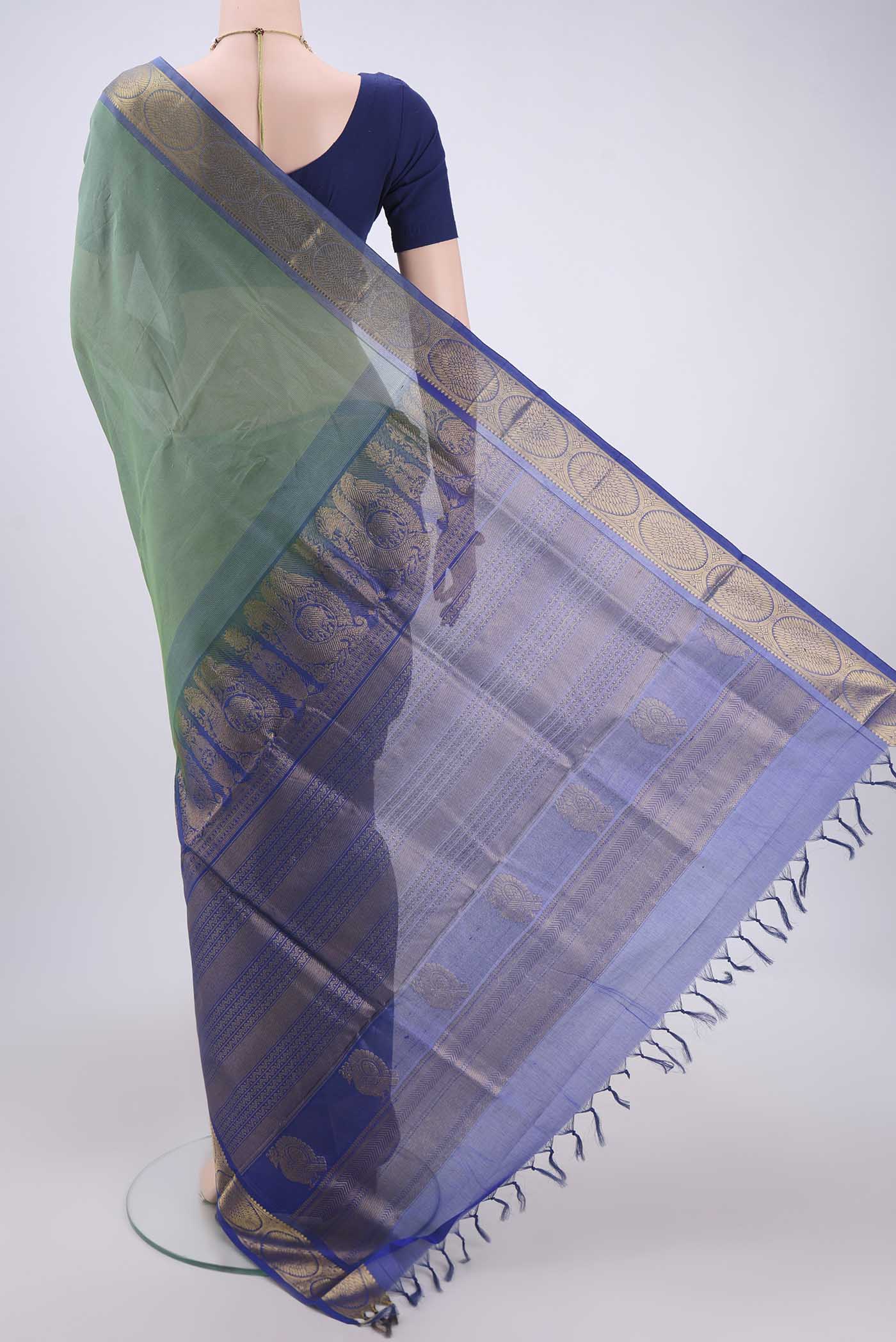 Flat view of Sea Green Silk Cotton Saree with Plain Body and Zari Border. 