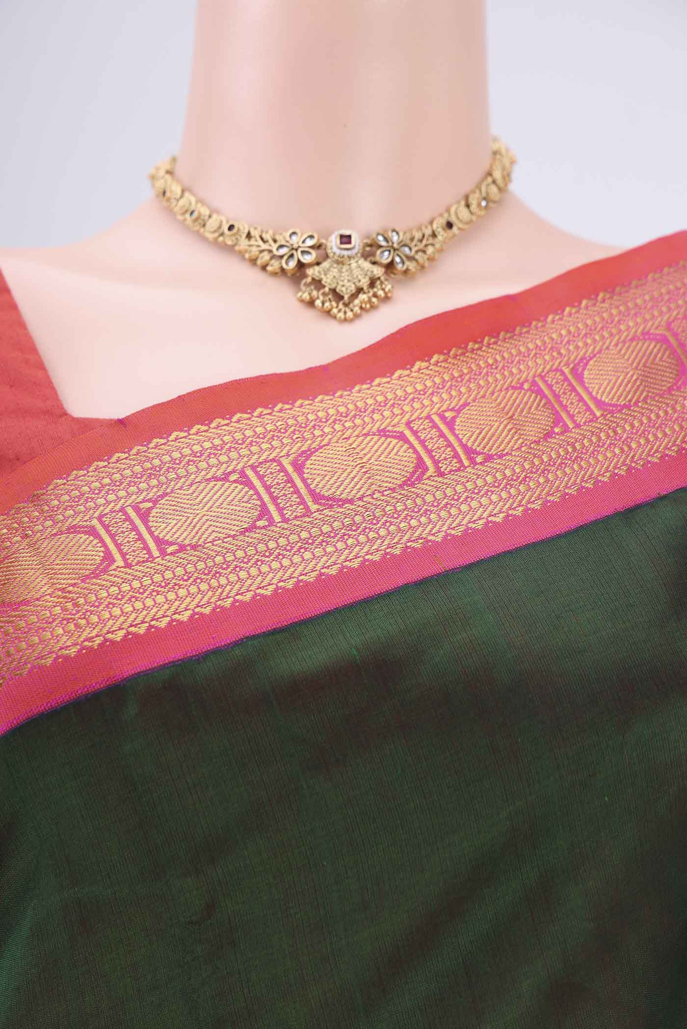 Border image of Bottle Green Silk Cotton Saree with Plain Body and Zari Border. 