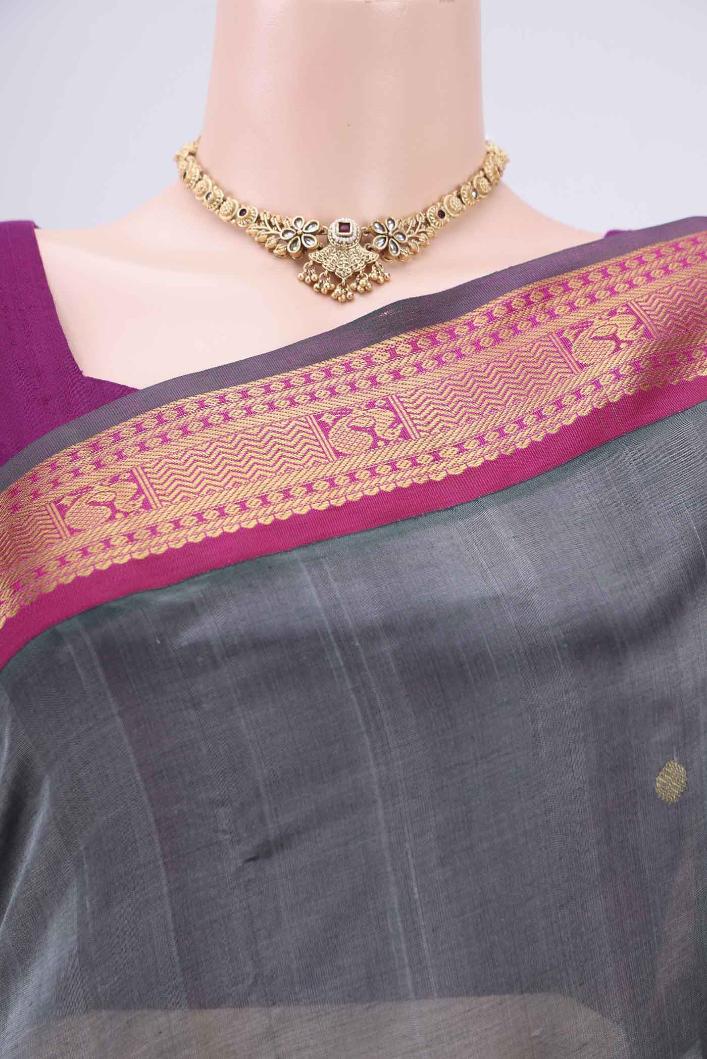 Border image of Grey Silk Cotton Saree with Zari Butta on the body and Zari Border. 