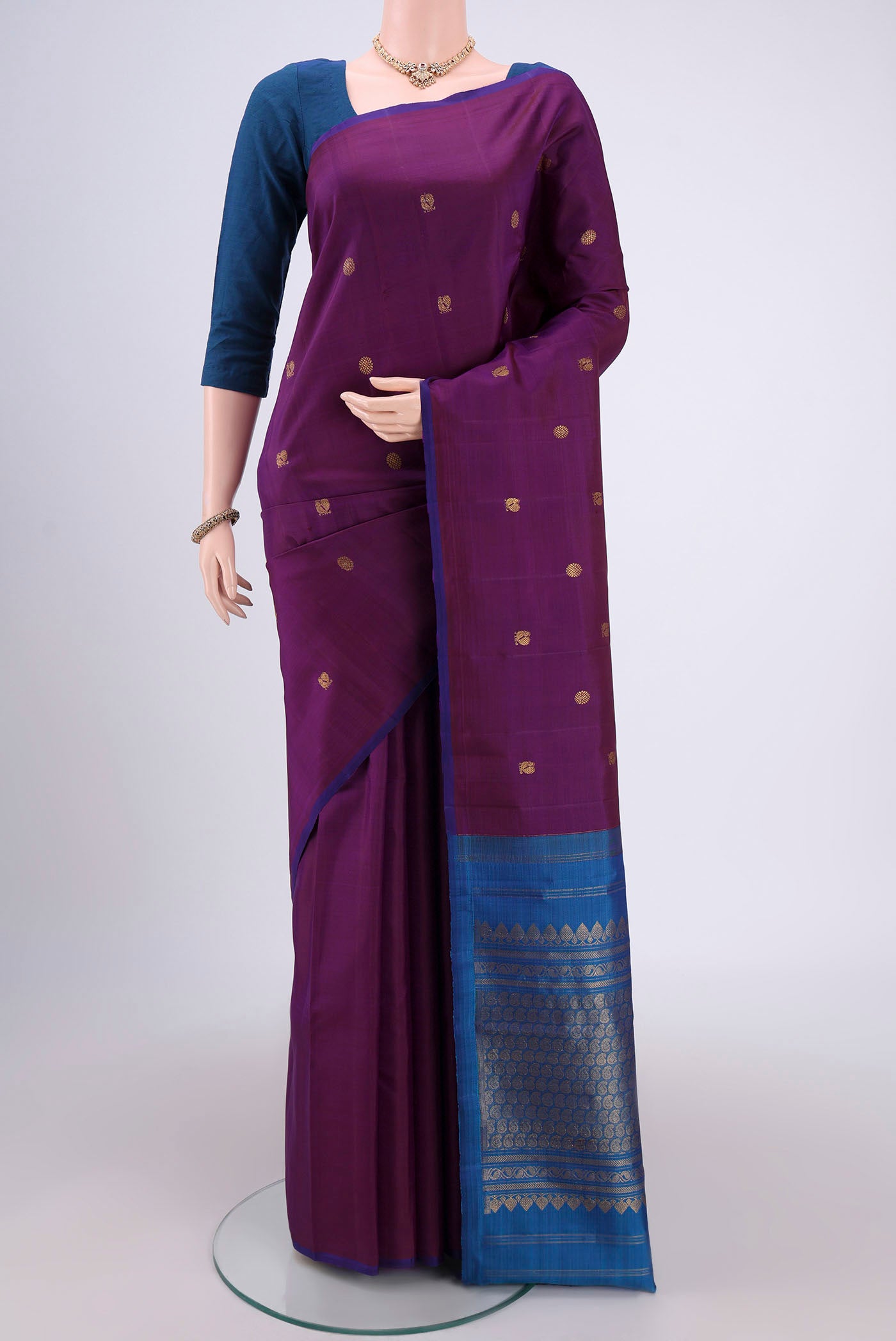 Purple Dual Tone Kanchipuram Silk Saree with Thread Butta on the body and Attached Border.  displayed on a mannequin