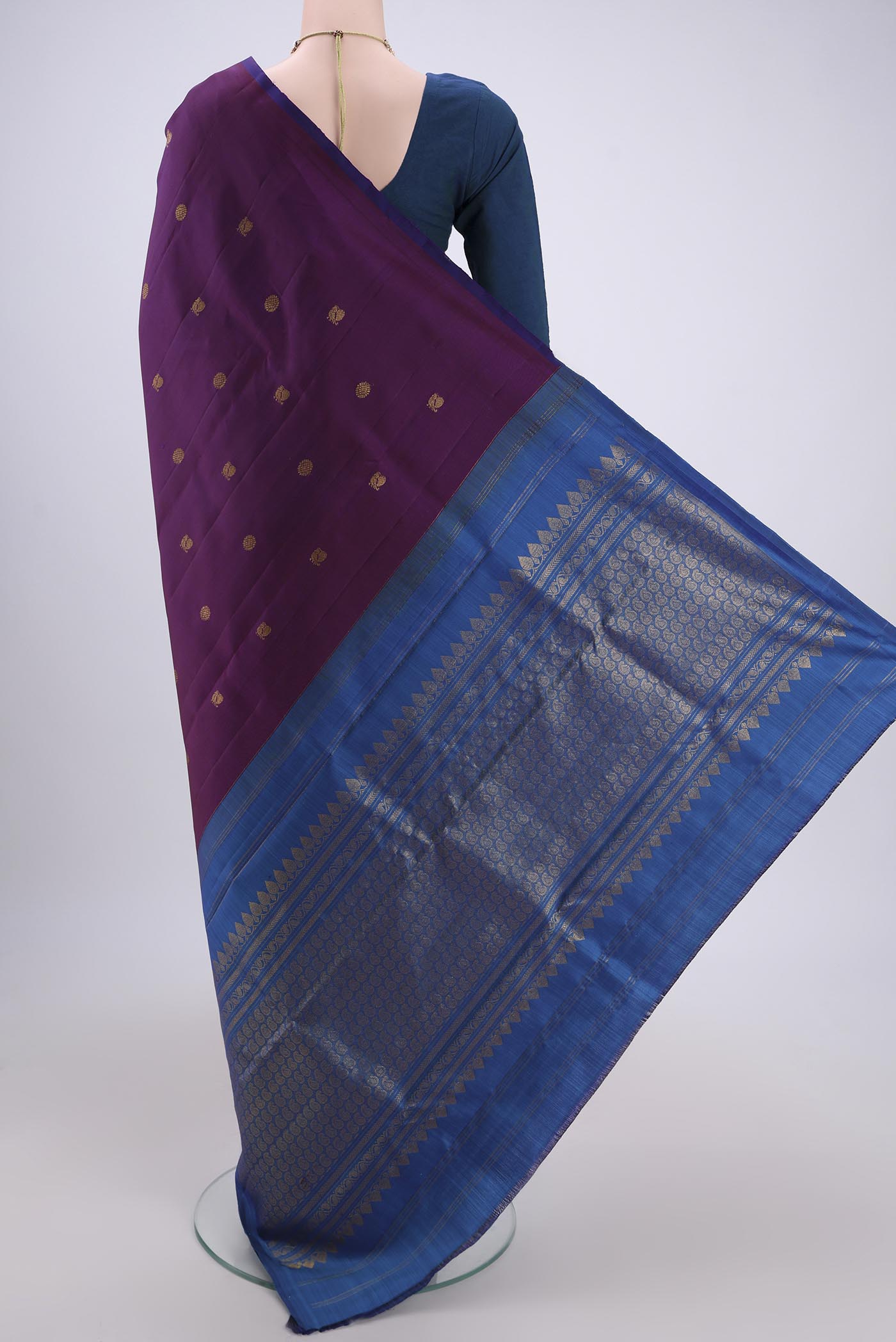 Flat view of Purple Dual Tone Kanchipuram Silk Saree with Thread Butta on the body and Attached Border. 