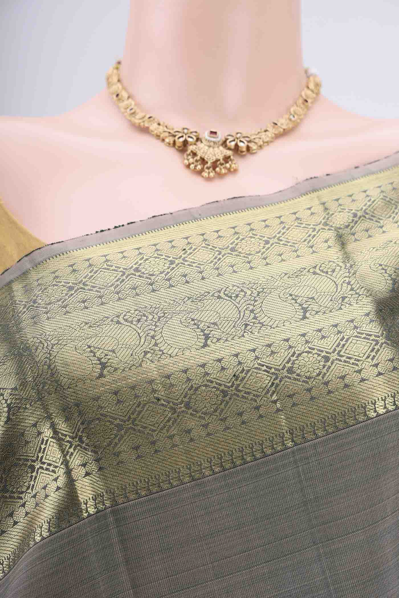 Border image of Grey Kanchipuram Silk Saree with Zari Butta on the body and Zari Border. 