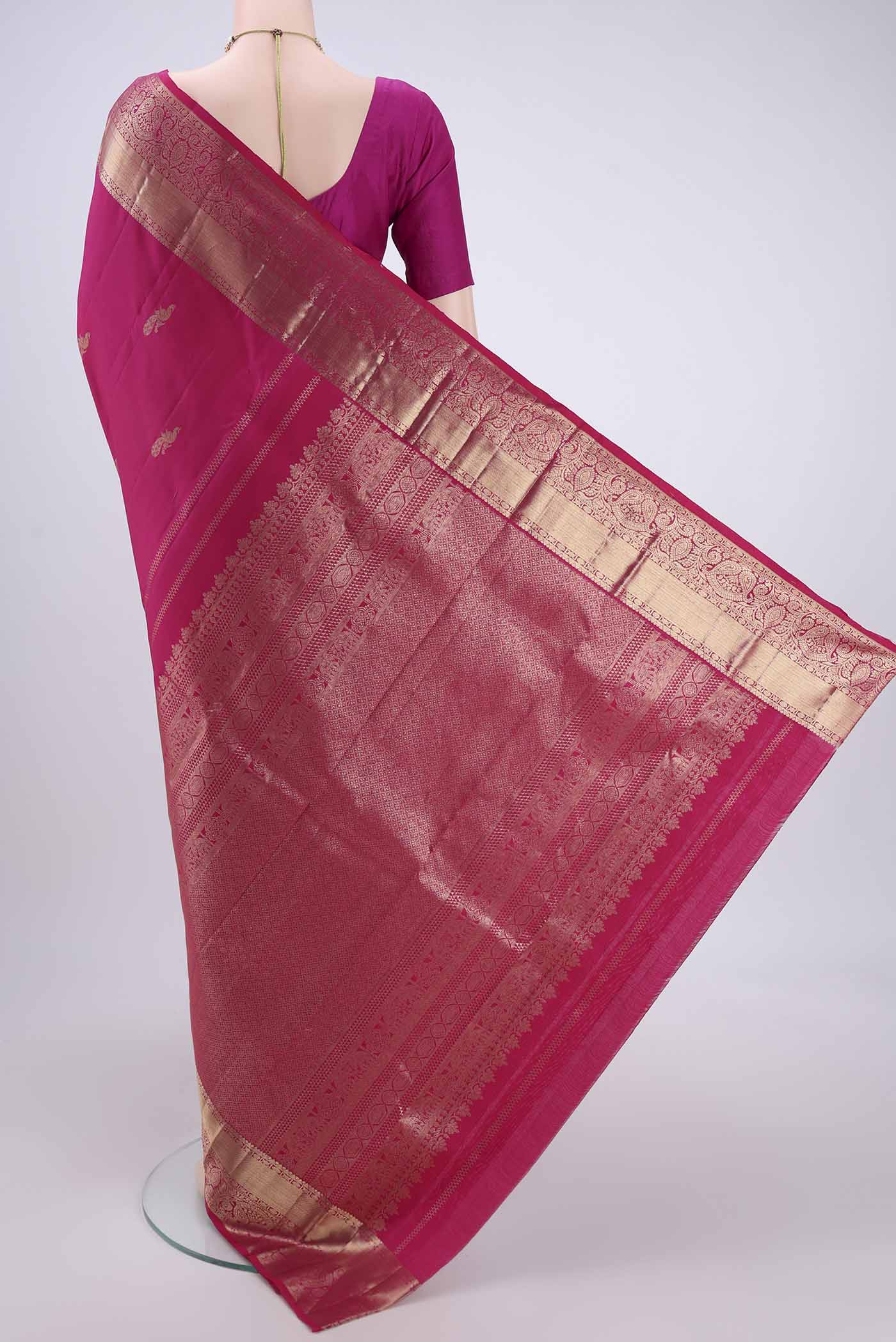Flat view of Rani Pink Kanchipuram Silk Saree with Checked design on the body and Zari Border. 