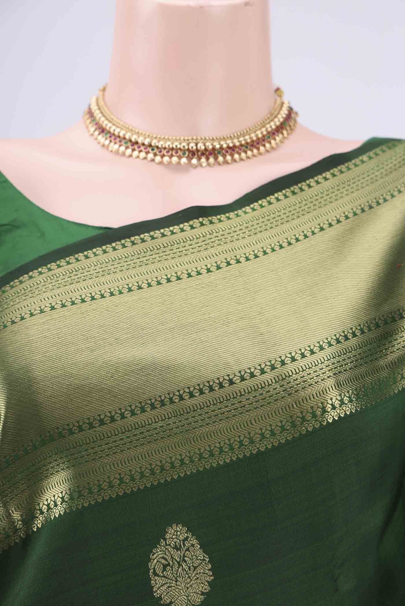 Border image of Bottle Green Kanchipuram Silk Saree with Zari Butta on the body and Zari Border. 