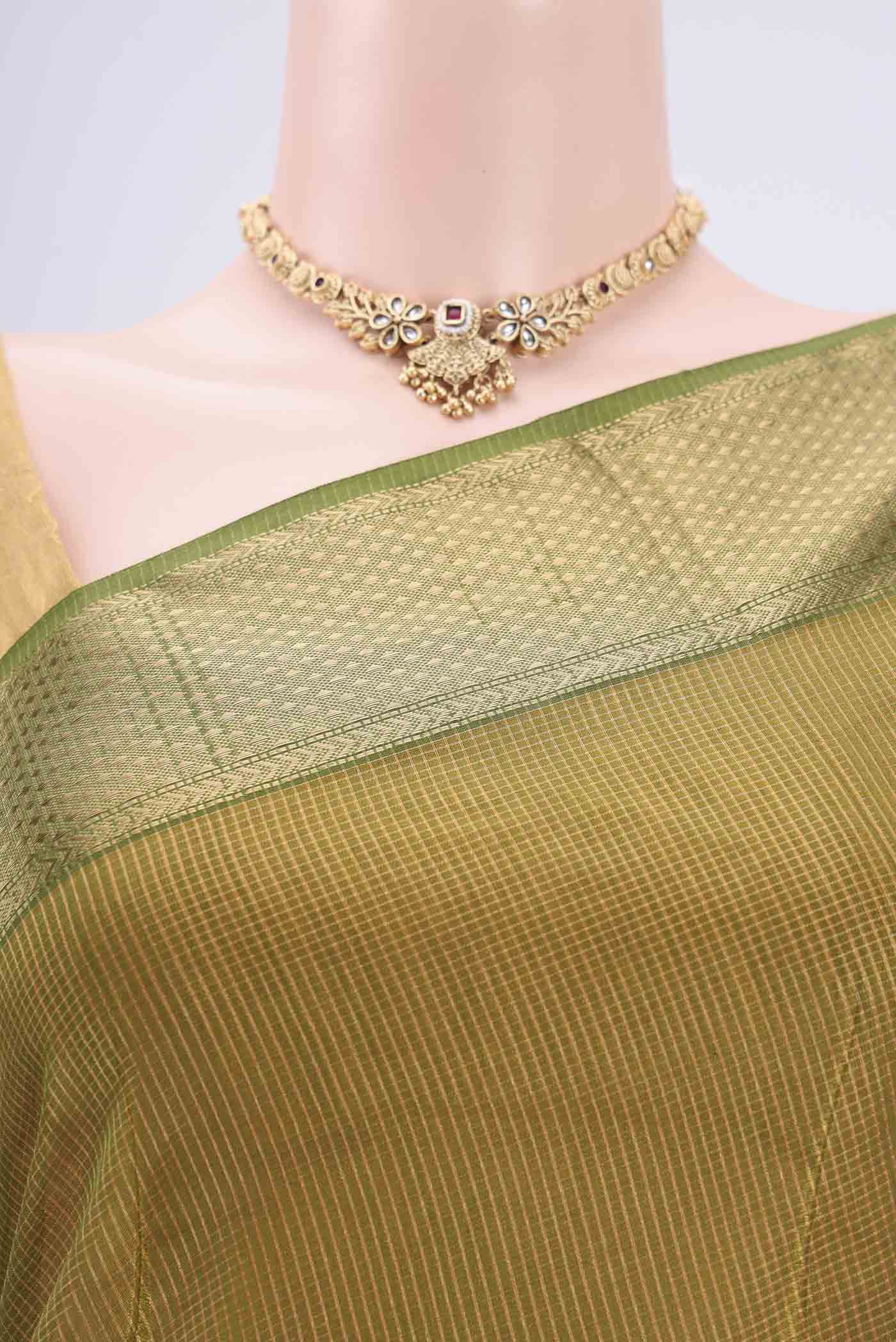 Border image of Mehandi Green Maheshwari Silk Cotton Saree with Zari And Thread Butta on the body and Zari Border. 