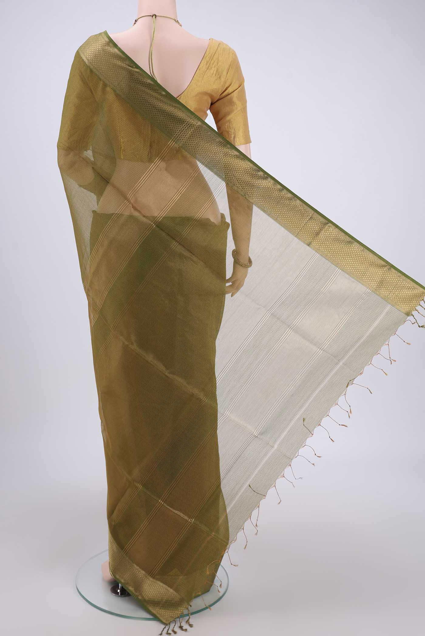 Flat view of Mehandi Green Maheshwari Silk Cotton Saree with Zari And Thread Butta on the body and Zari Border. 