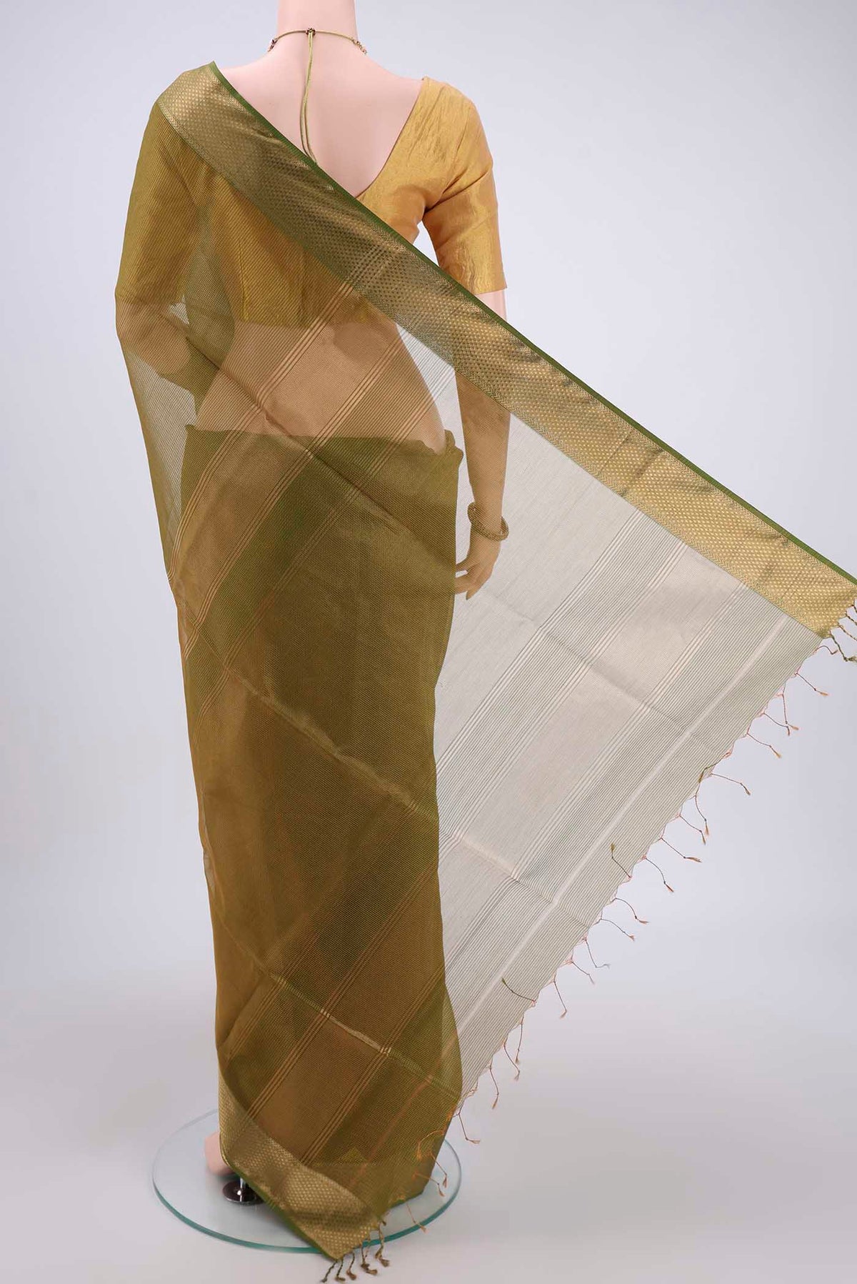 Flat view of Mehandi Green Maheshwari Silk Cotton Saree with Zari And Thread Butta on the body and Zari Border. 