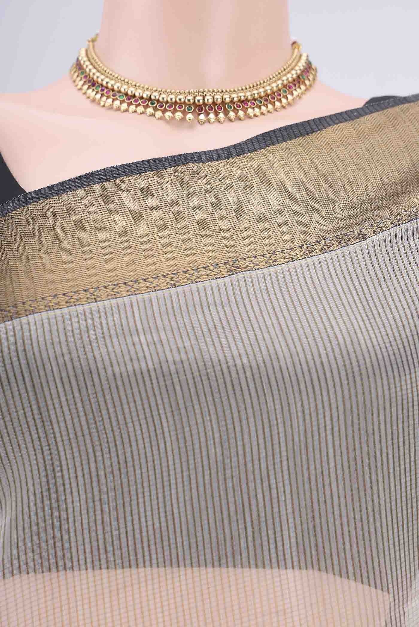 Border image of Beige Maheshwari Silk Cotton Saree with Checked design on the body and Zari Border. 