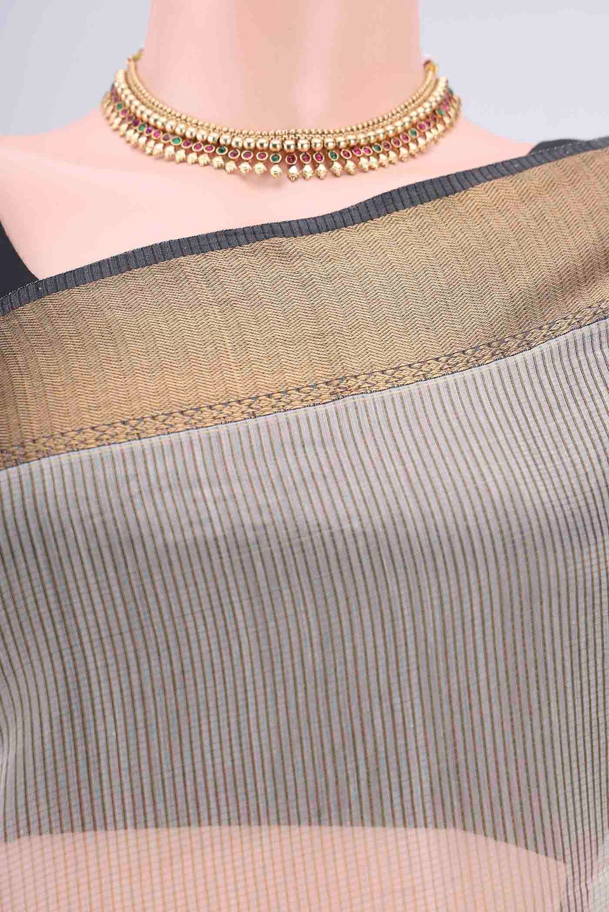 Border image of Beige Maheshwari Silk Cotton Saree with Checked design on the body and Zari Border. 