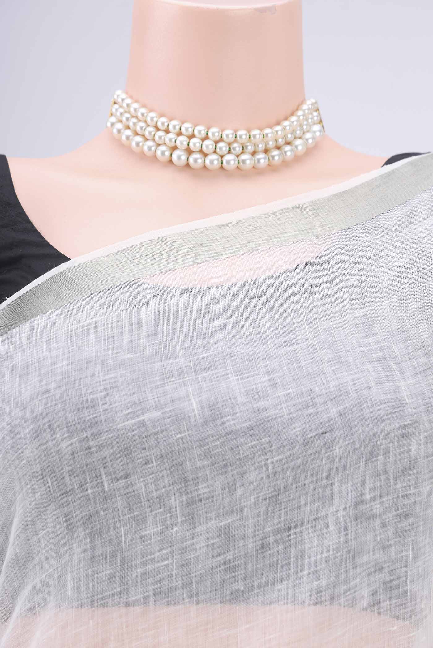 Border image of Off White Linen Saree with Plain Body and Zari Border. 