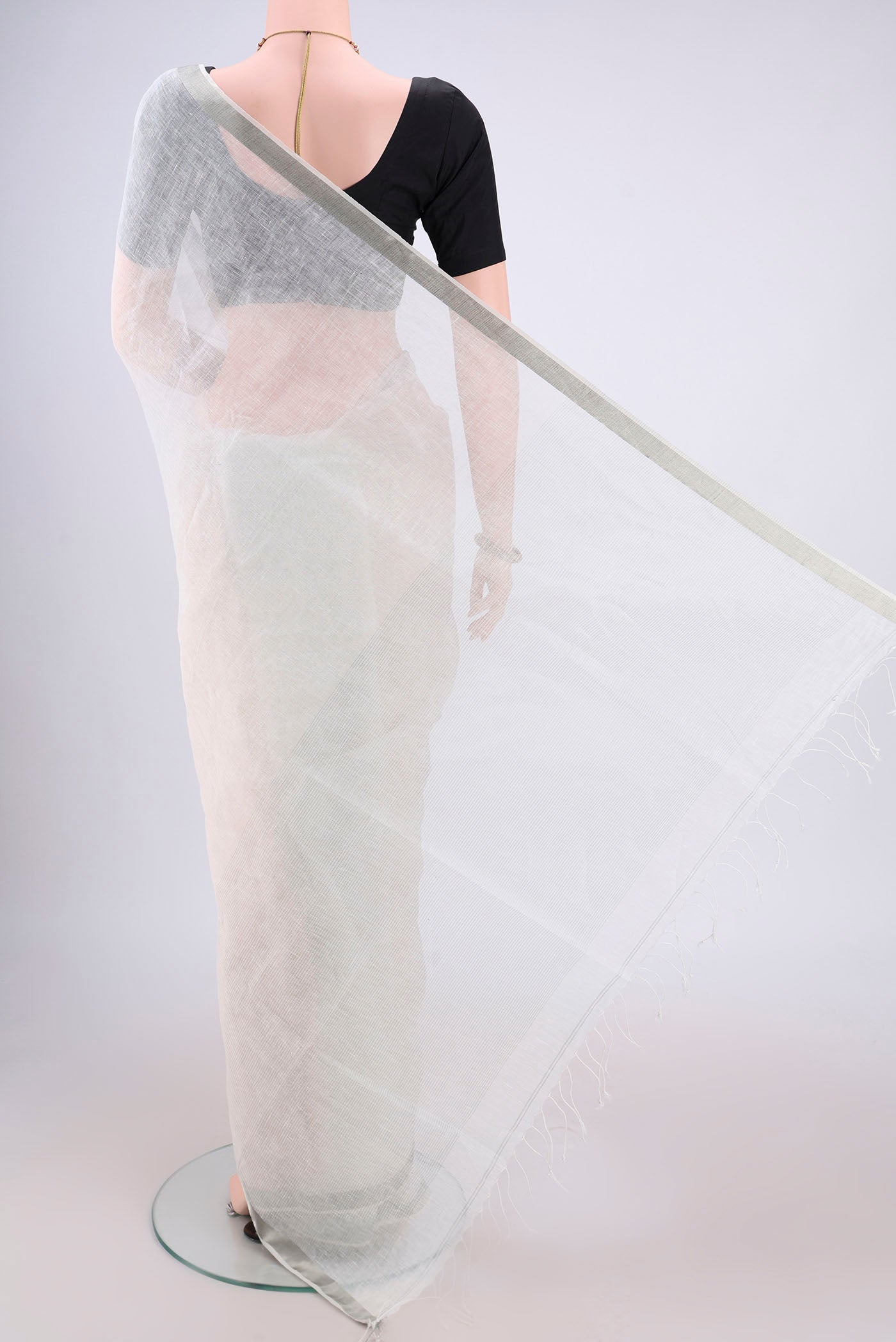 Flat view of Off White Linen Saree with Plain Body and Zari Border. 