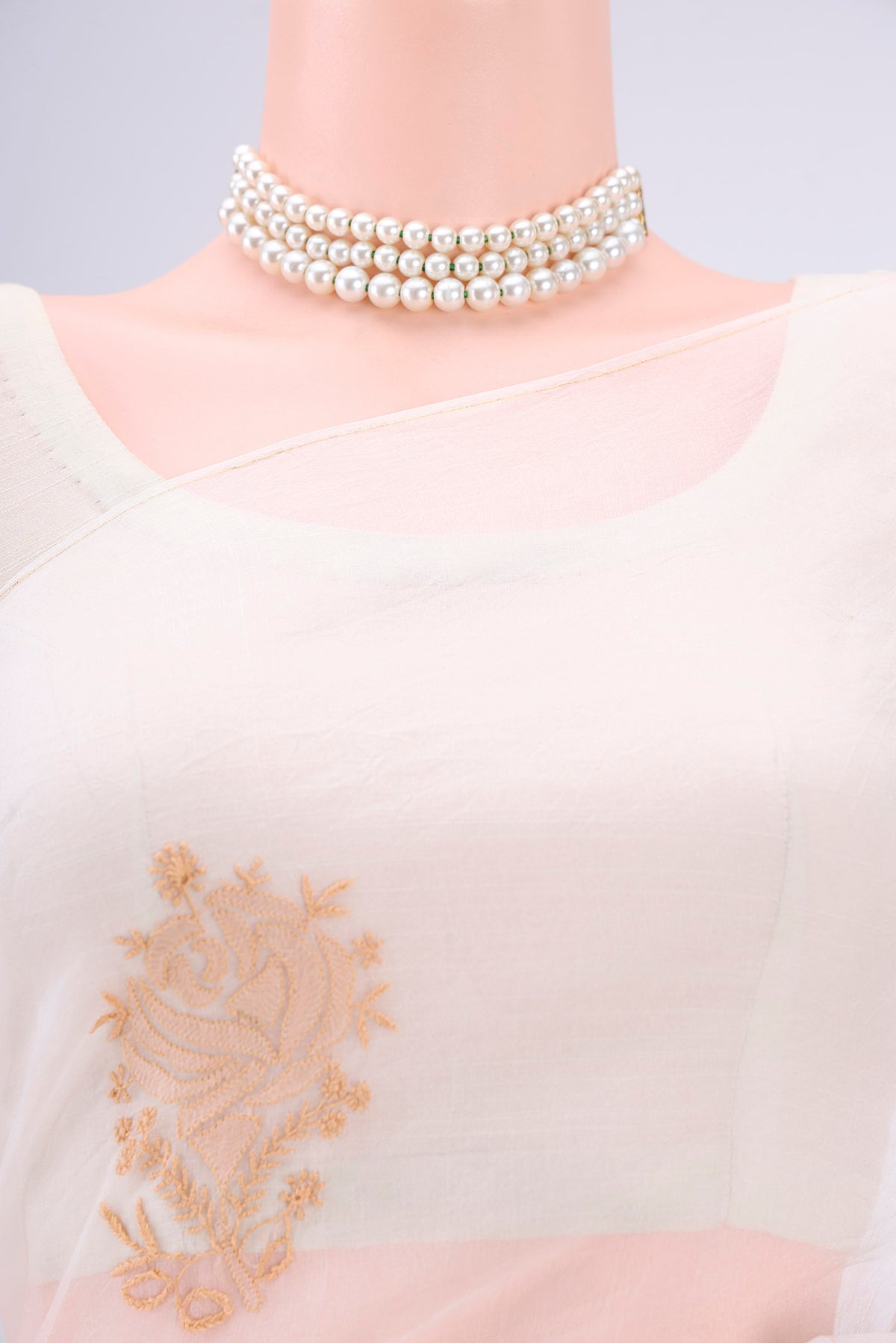 Border image of White Organza Silk Saree with Embroidery on the body and Thin Zari Line. 