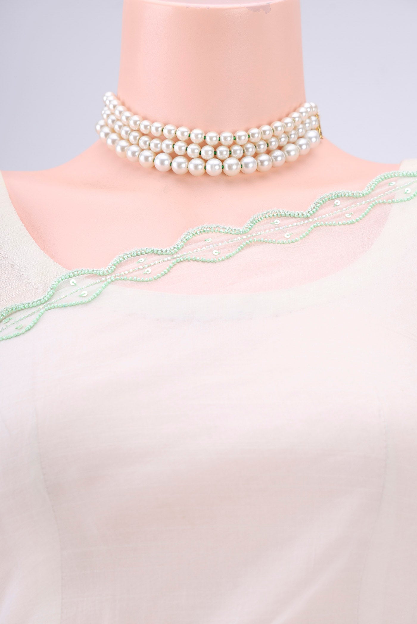 Border image of White Organza Silk Saree with Embroidery on the body and Thin Zari Line. 