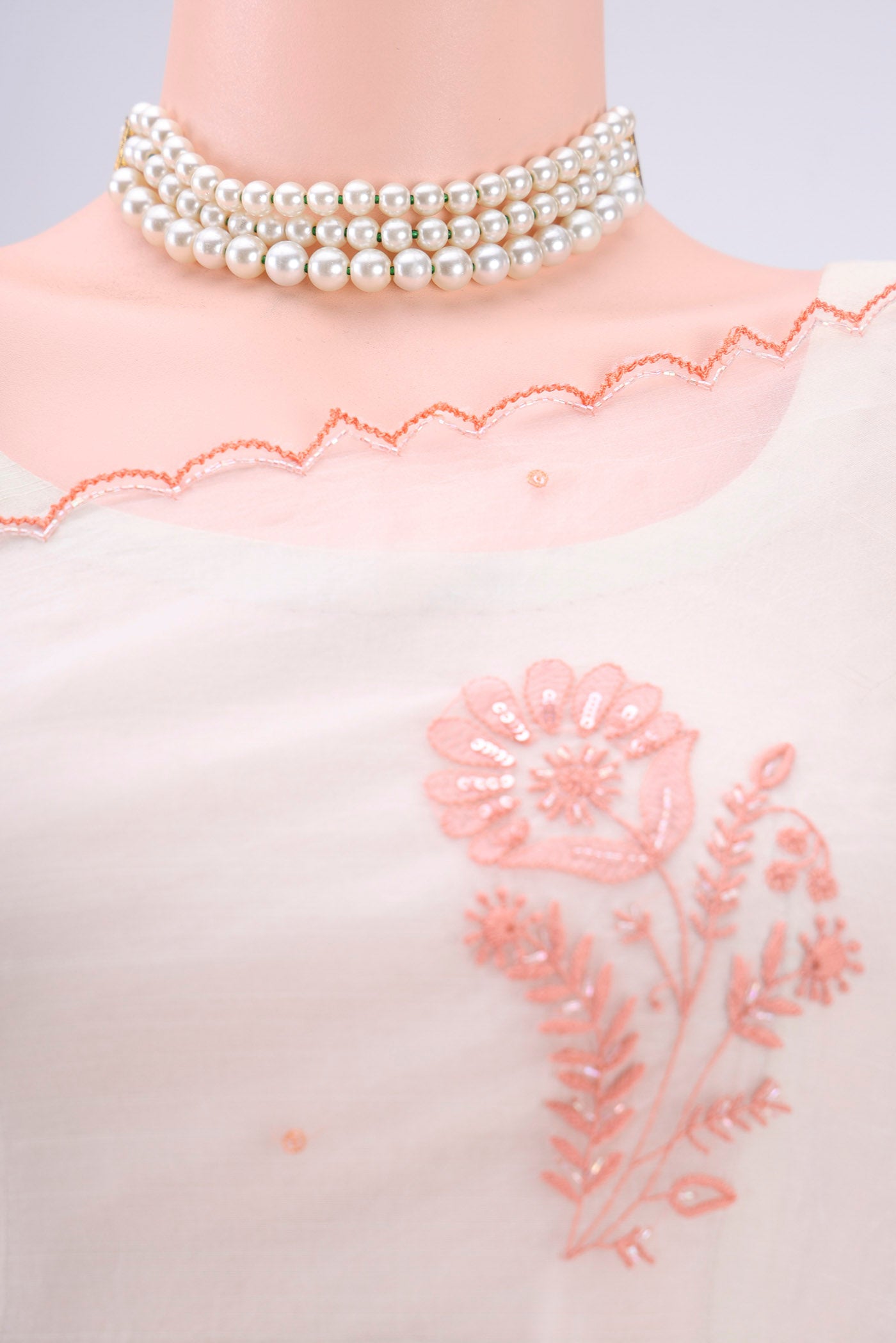 Border image of White Organza Silk Saree with Embroidery on the body and Thin Zari Line. 