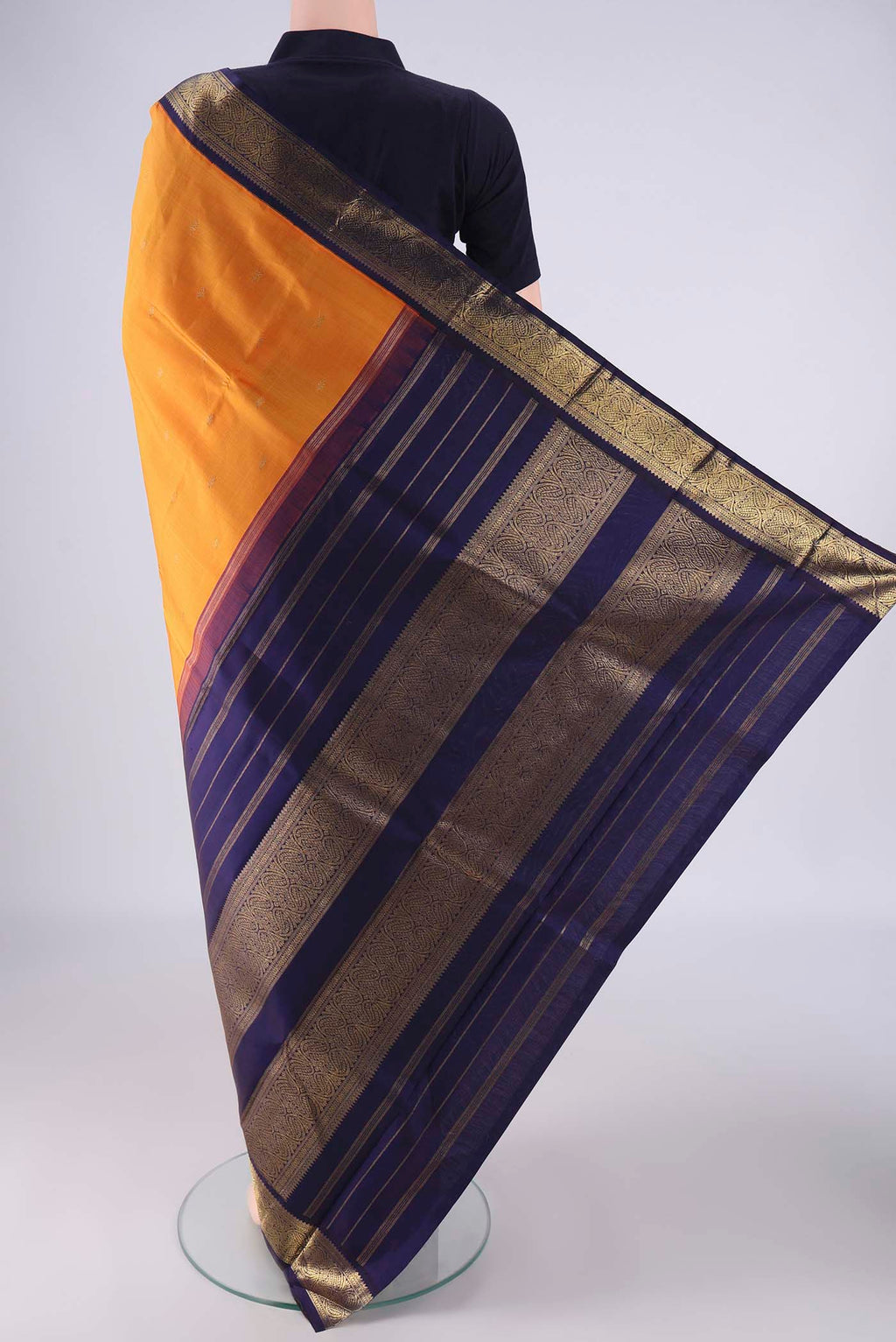 Flat view of Pure Silk Pure Zari Brick Orange Kanjivaram Saree with Zari Butta on the body and Zari Border. 
