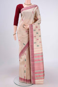 Beige Kanchipuram Saree with Thread Butta on the body and Thread Border.  displayed on a mannequin