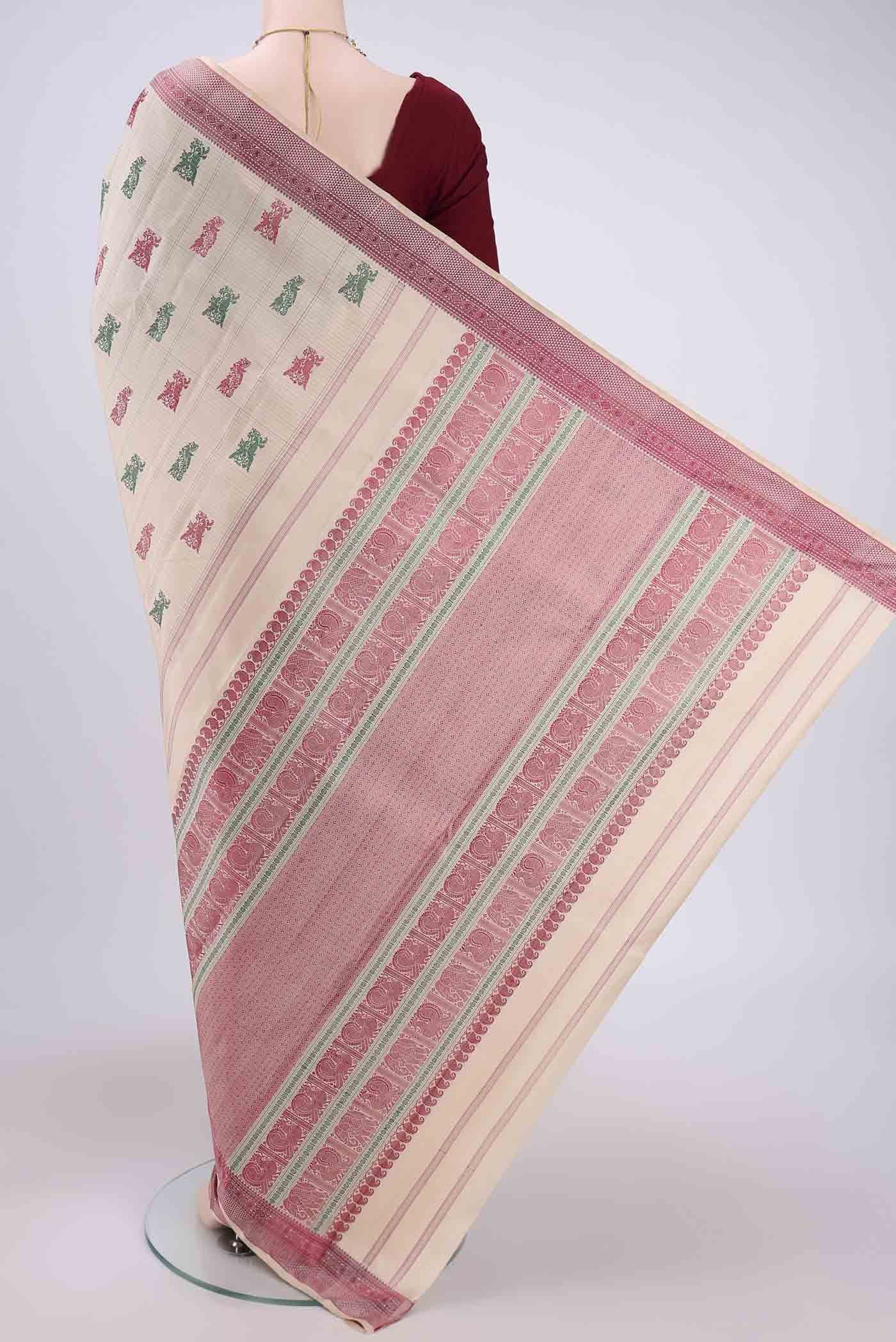 Flat view of Beige Kanchipuram Saree with Thread Butta on the body and Thread Border. 