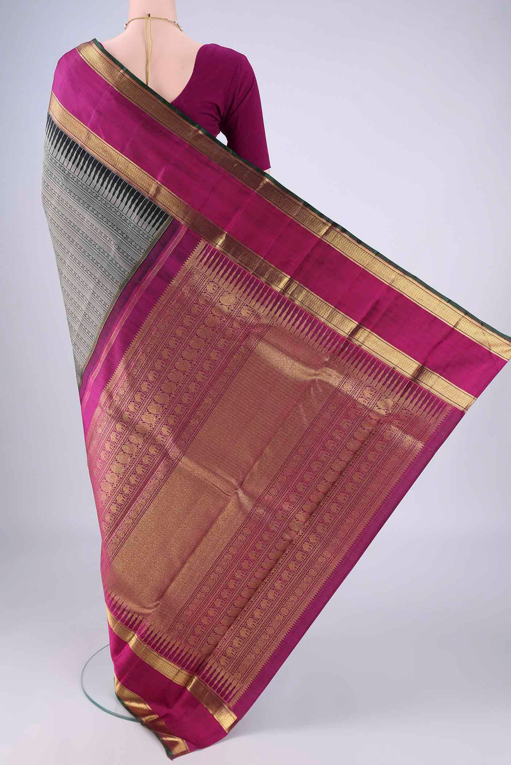 Flat view of Black Kanjivaram Silk Saree with Jacquard design on the body and Zari Border. 