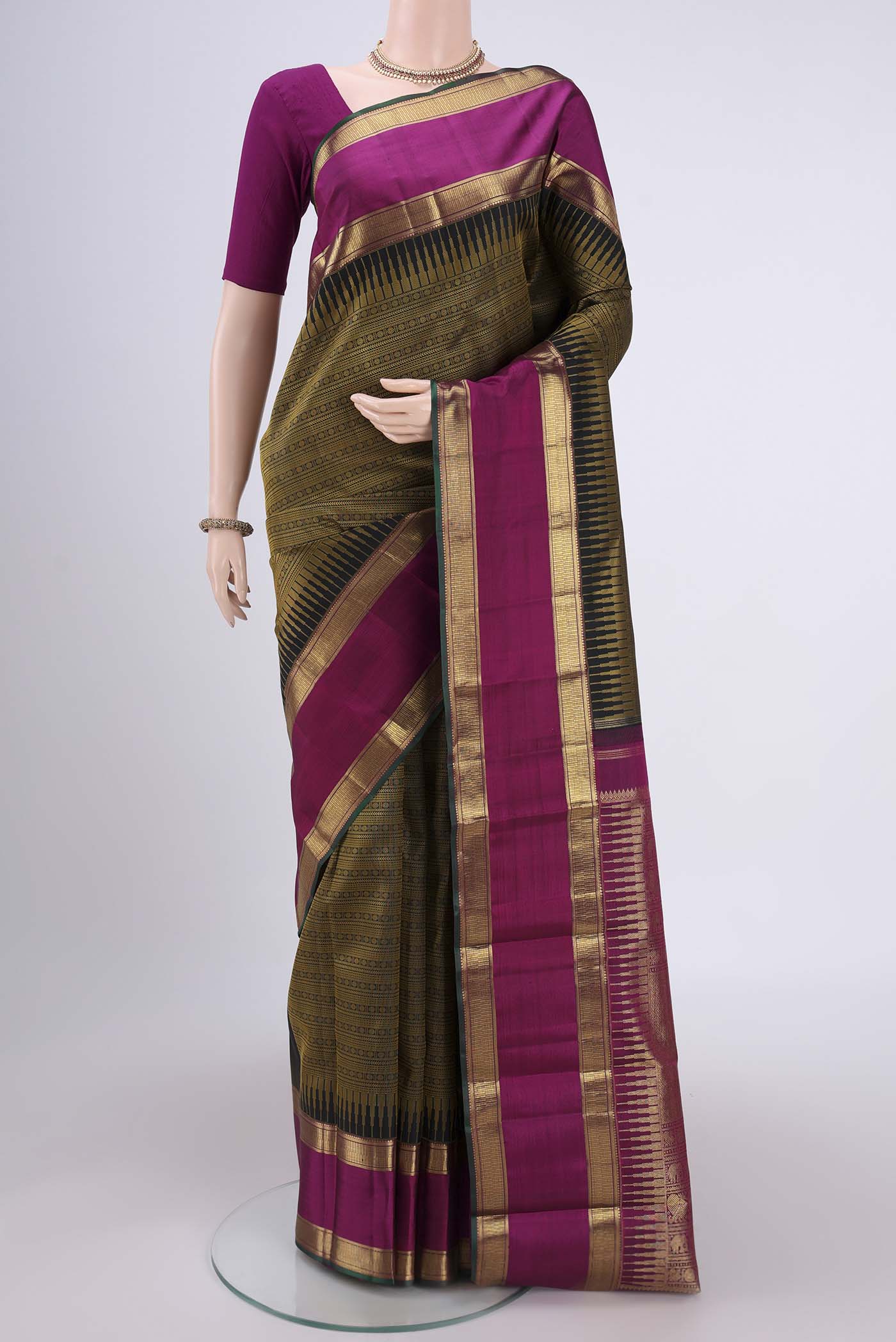 Pure Silk Pure Zari Black Dual Tone Kanjivaram Saree with Jacquard design on the body and Zari Border.  displayed on a mannequin