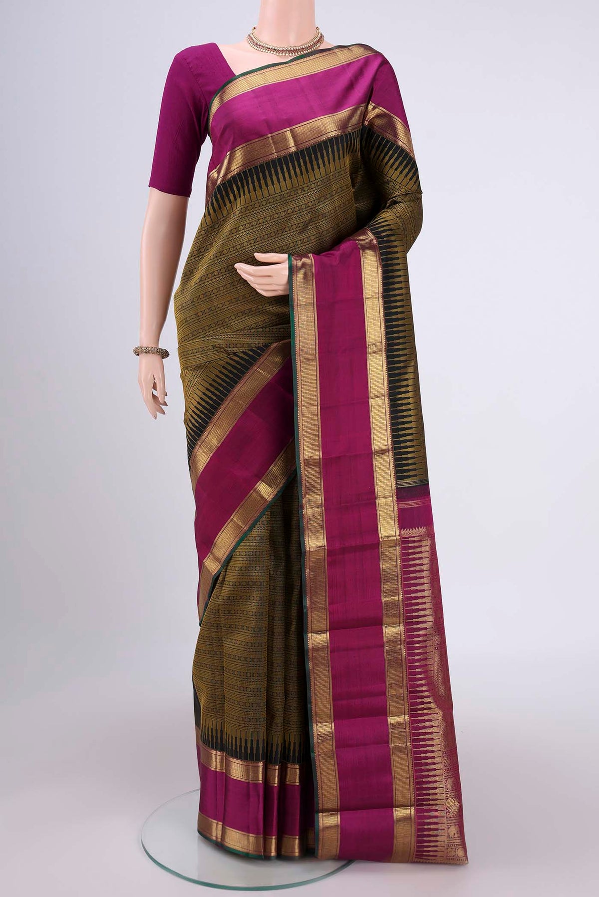 Pure Silk Pure Zari Black Dual Tone Kanjivaram Saree with Jacquard design on the body and Zari Border.  displayed on a mannequin