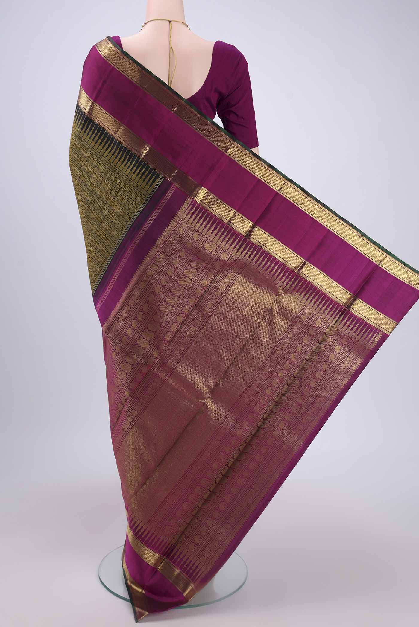 Flat view of Pure Silk Pure Zari Black Dual Tone Kanjivaram Saree with Jacquard design on the body and Zari Border. 