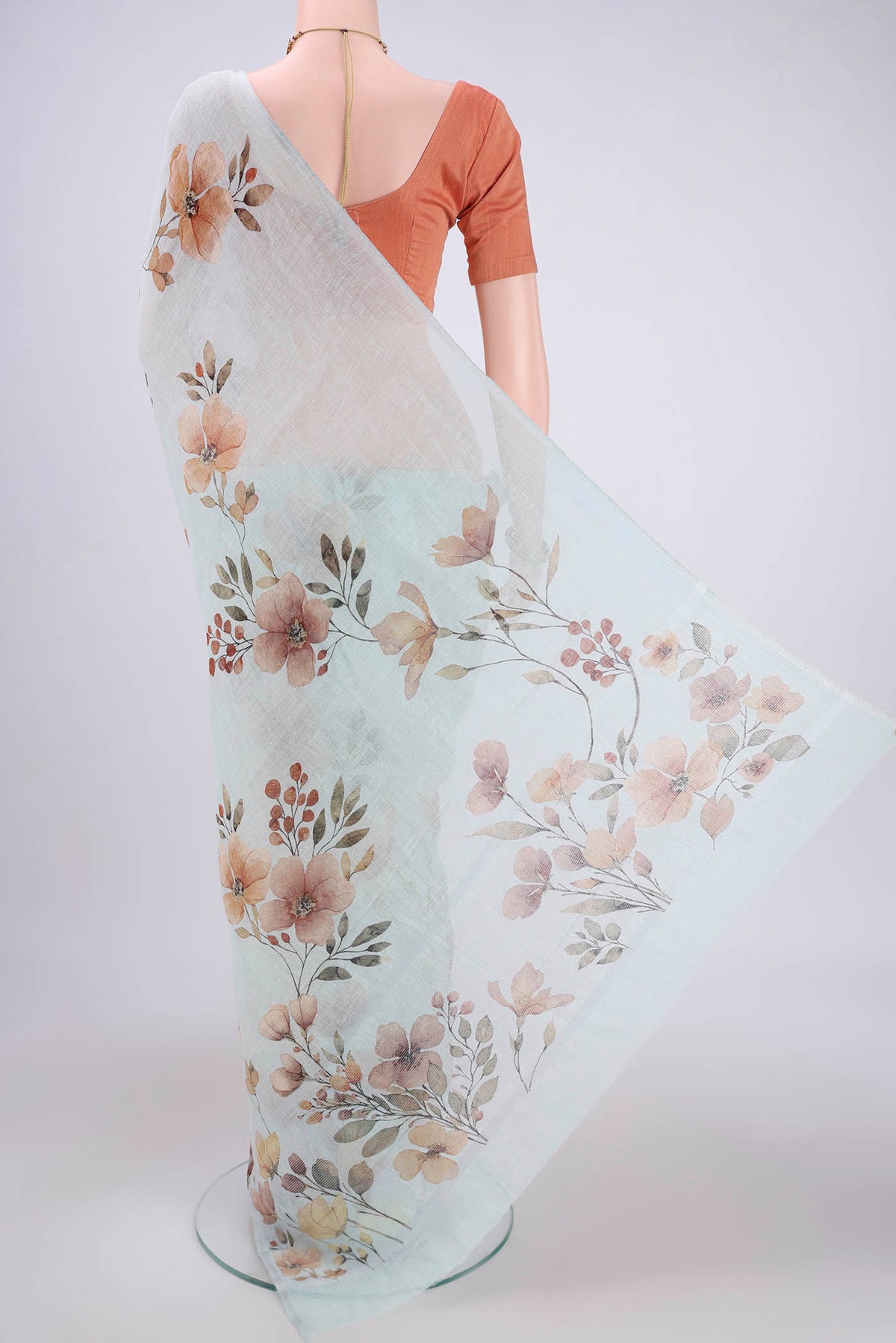 Flat view of Sky Blue Linen Saree with Floral Print on the body and Zari Border. 