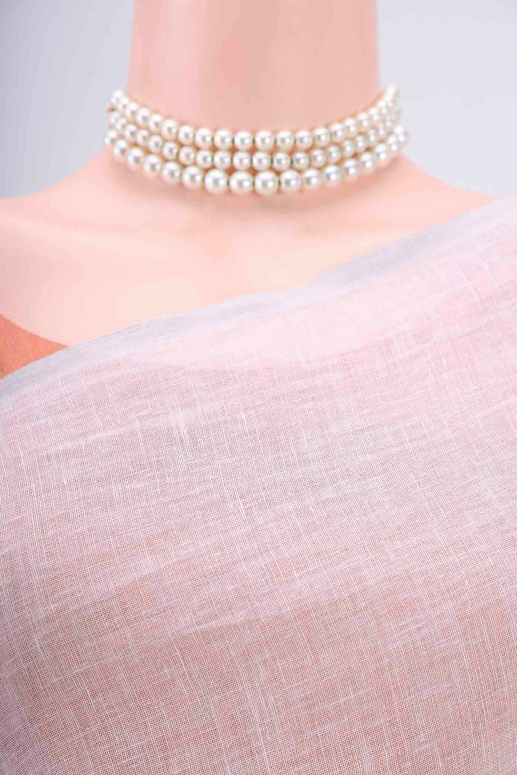 Border image of Off White Linen Saree with Floral Print on the body and Zari Border. 