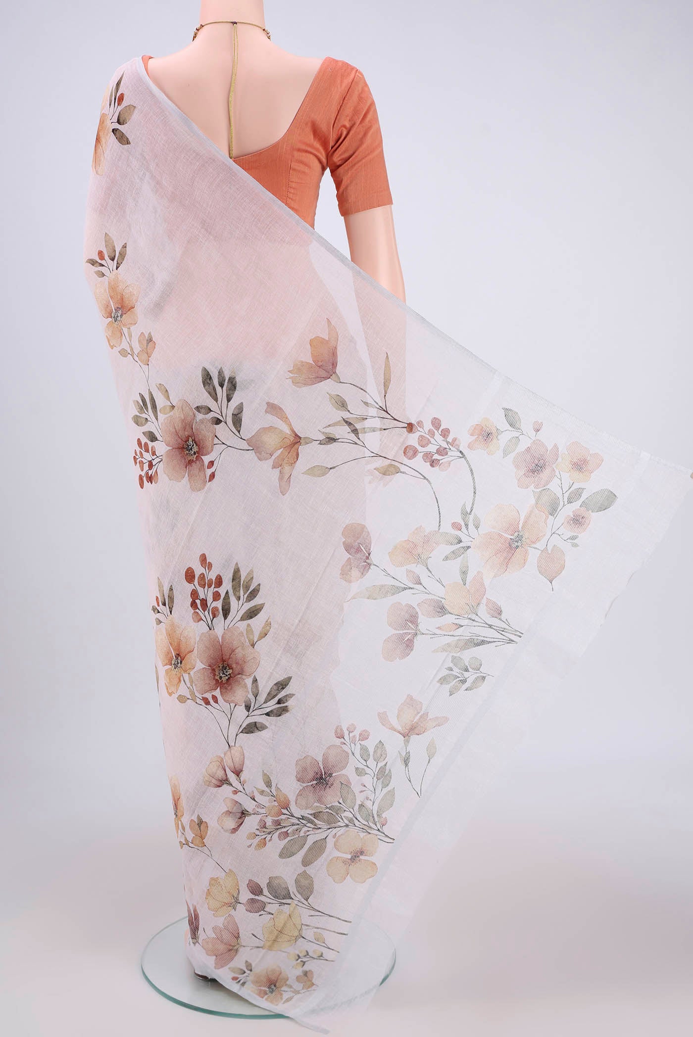 Flat view of Off White Linen Saree with Floral Print on the body and Zari Border. 