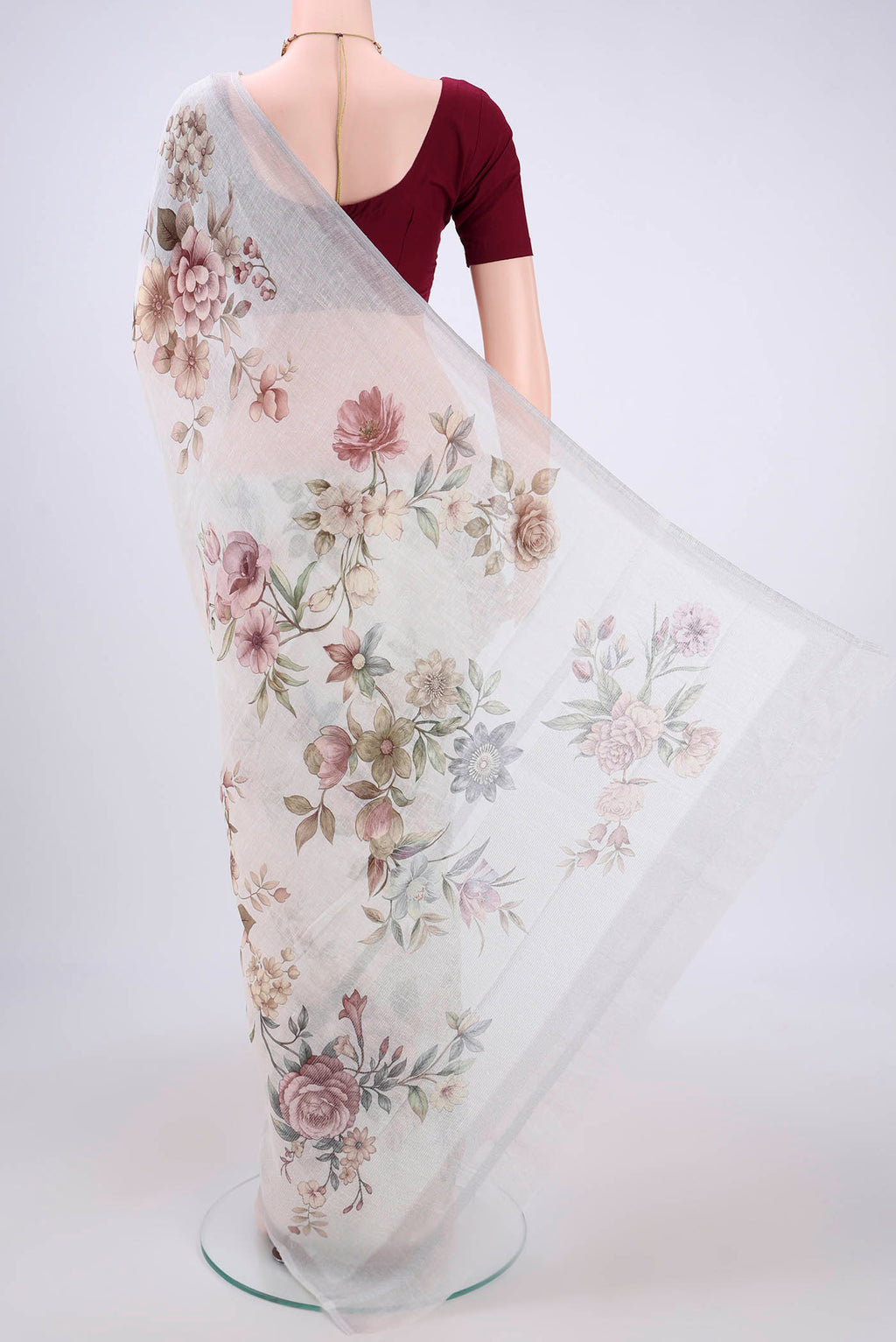 Flat view of Off White Linen Saree with Floral Print on the body and Zari Border. 