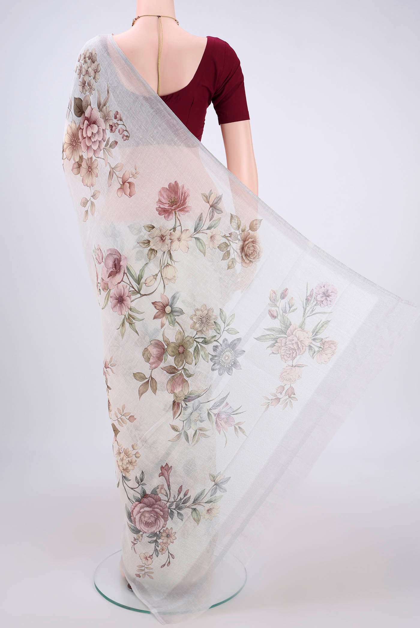 Flat view of Off White Linen Saree with Floral Print on the body and Zari Border. 