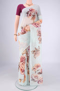 Sky Blue Linen Cotton Saree with Printed design on the body and Thin Zari Line.  displayed on a mannequin