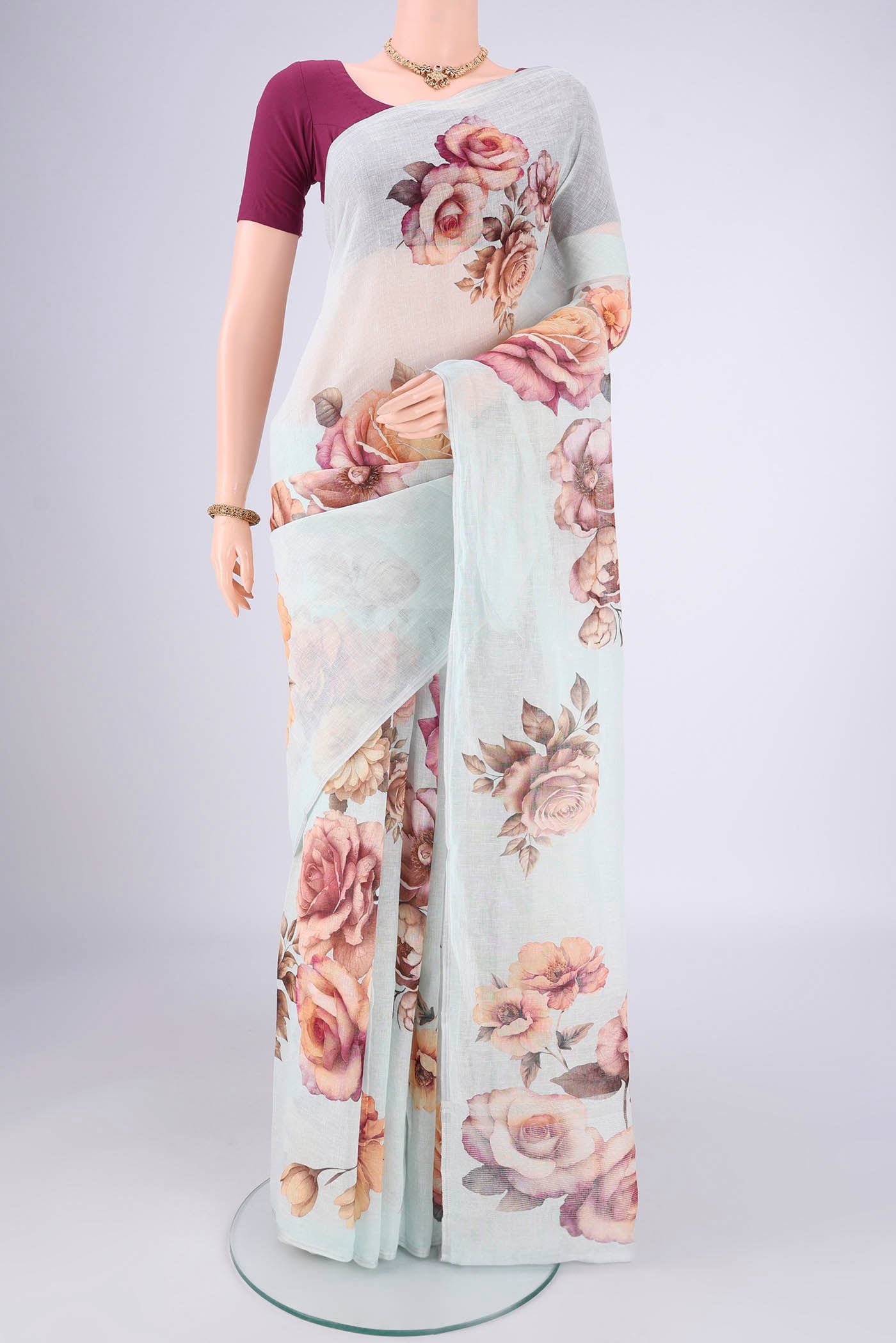 Sky Blue Linen Cotton Saree with Printed design on the body and Thin Zari Line.  displayed on a mannequin