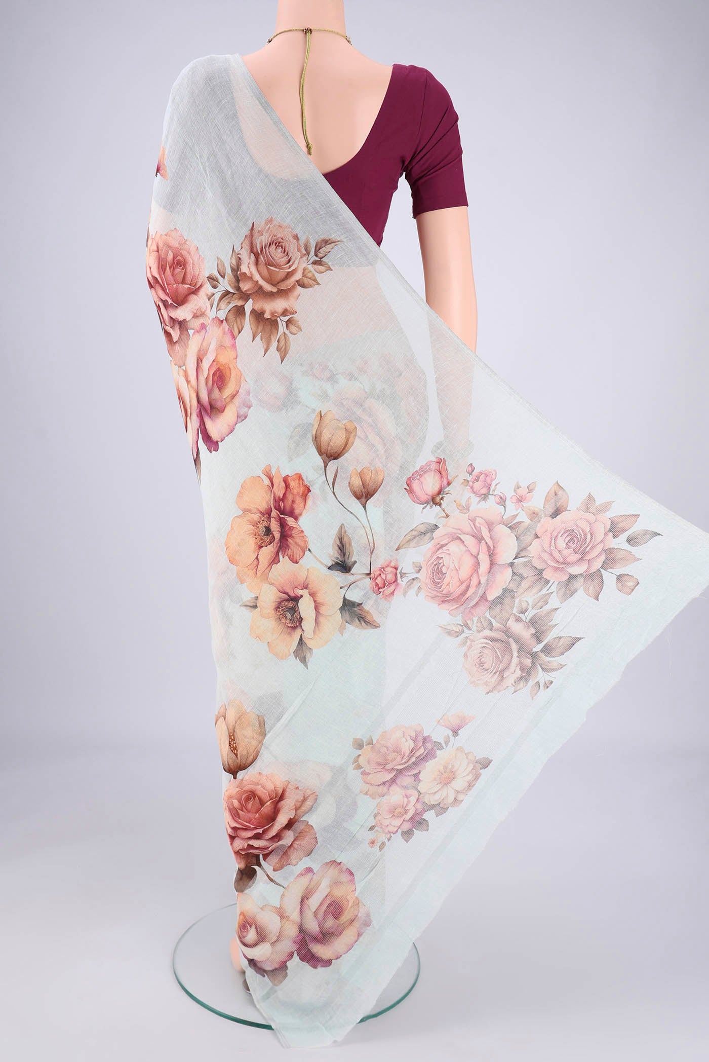 Flat view of Sky Blue Linen Cotton Saree with Printed design on the body and Thin Zari Line. 