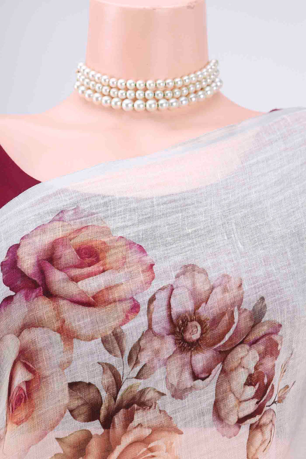 Border image of White Linen Saree with Floral Print on the body and Zari Border. 