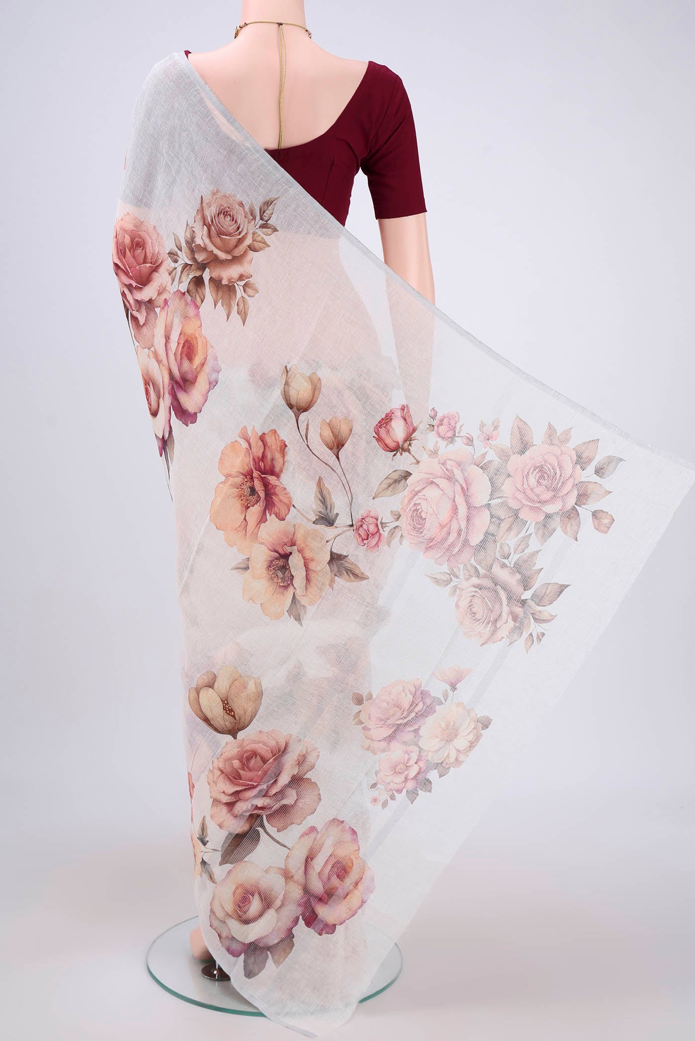 Flat view of White Linen Saree with Floral Print on the body and Zari Border. 