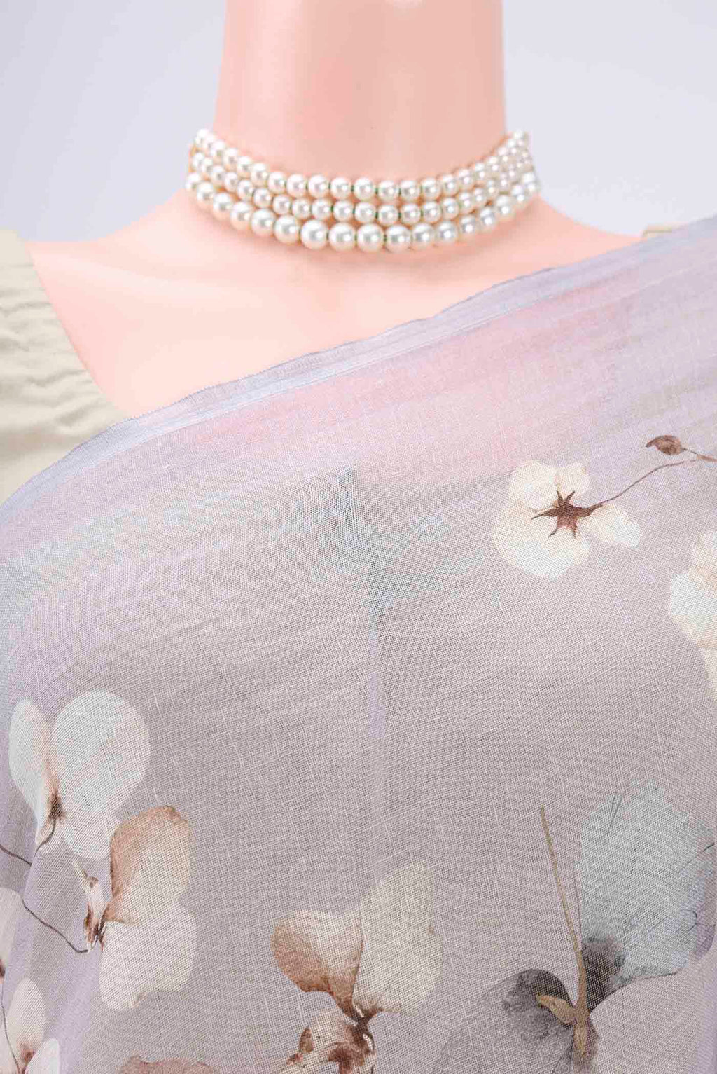 Border image of Grey Linen Saree with Floral Print on the body and Zari Border. 