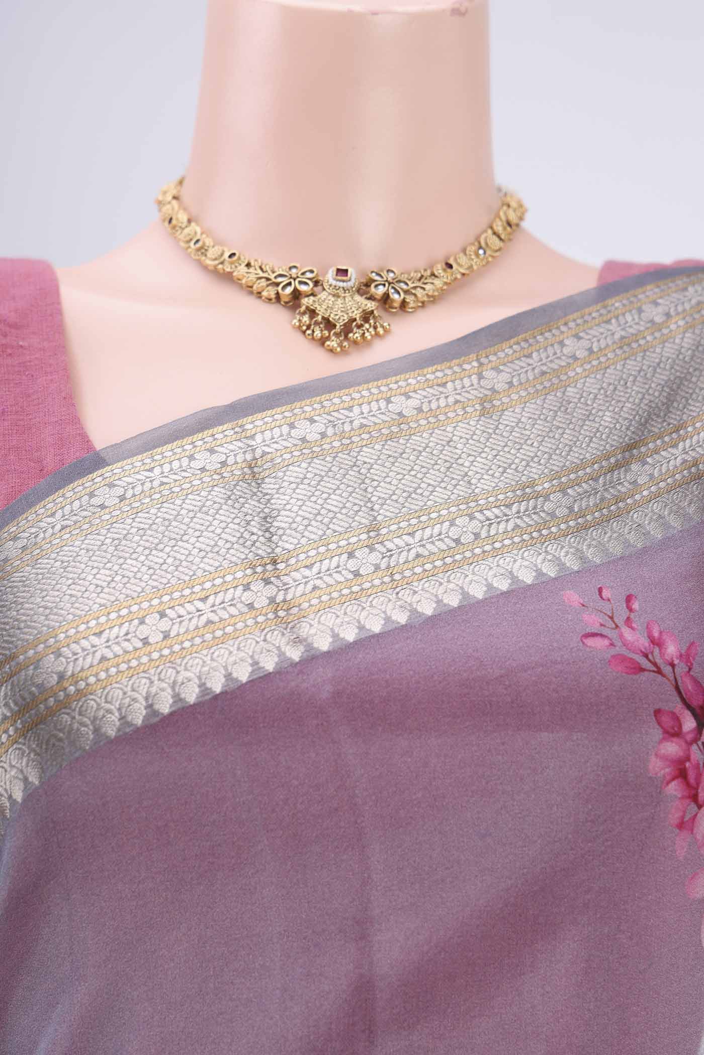 Border image of Blue Grey Organza Silk Saree with Printed design on the body and Zari Border. 