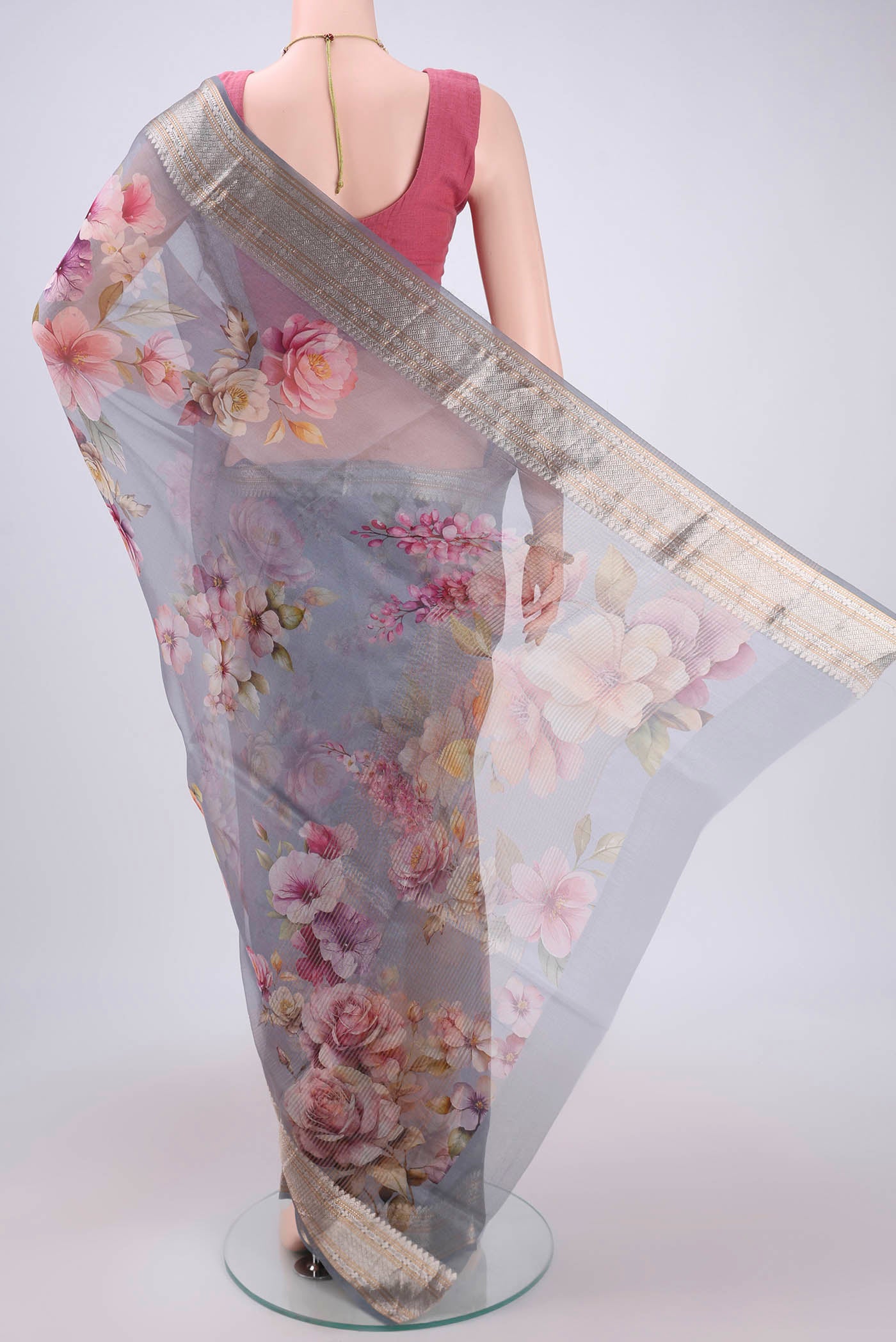 Flat view of Blue Grey Organza Silk Saree with Printed design on the body and Zari Border. 