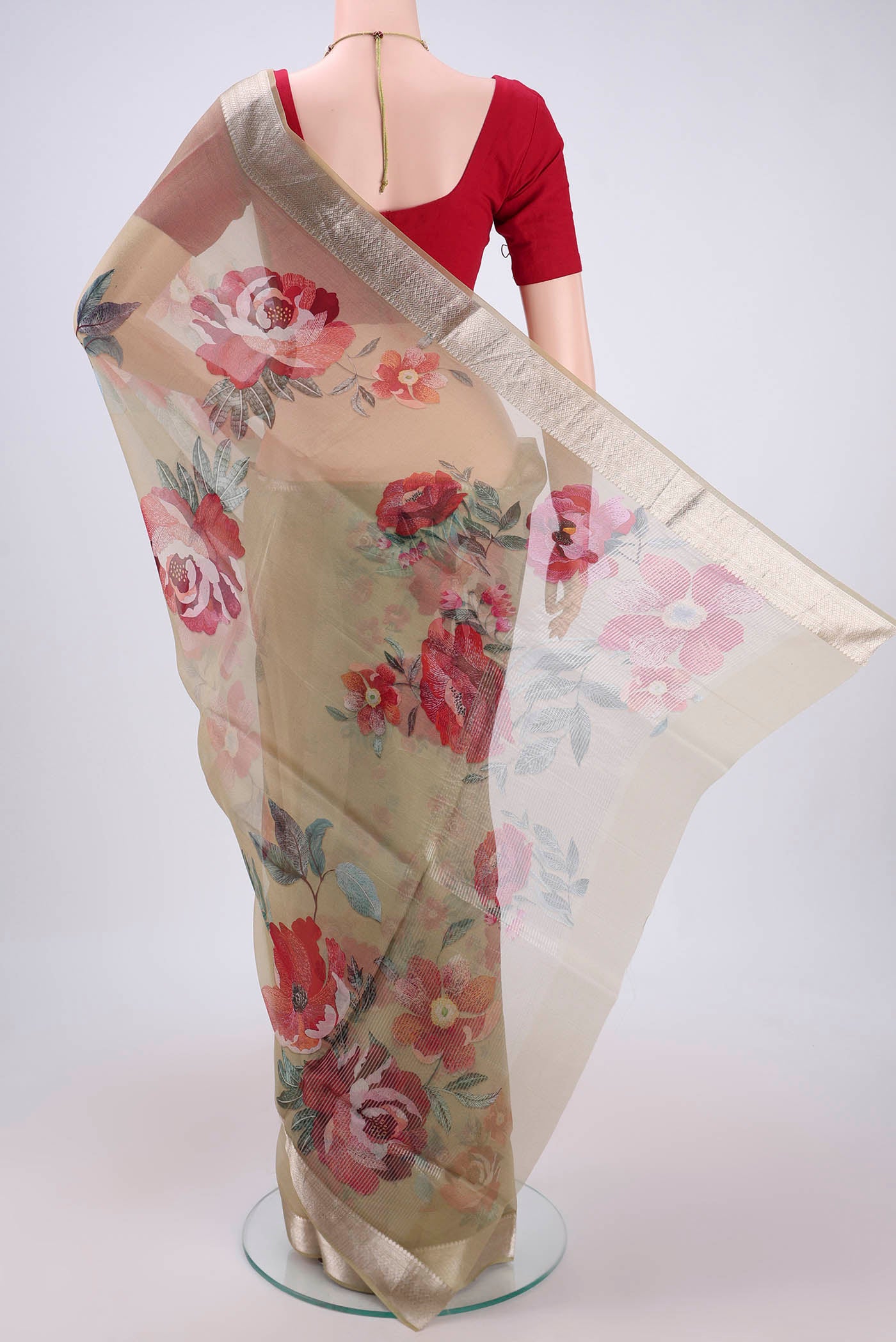 Flat view of Sage Green Organza Silk Saree with Printed design on the body and Zari Border. 