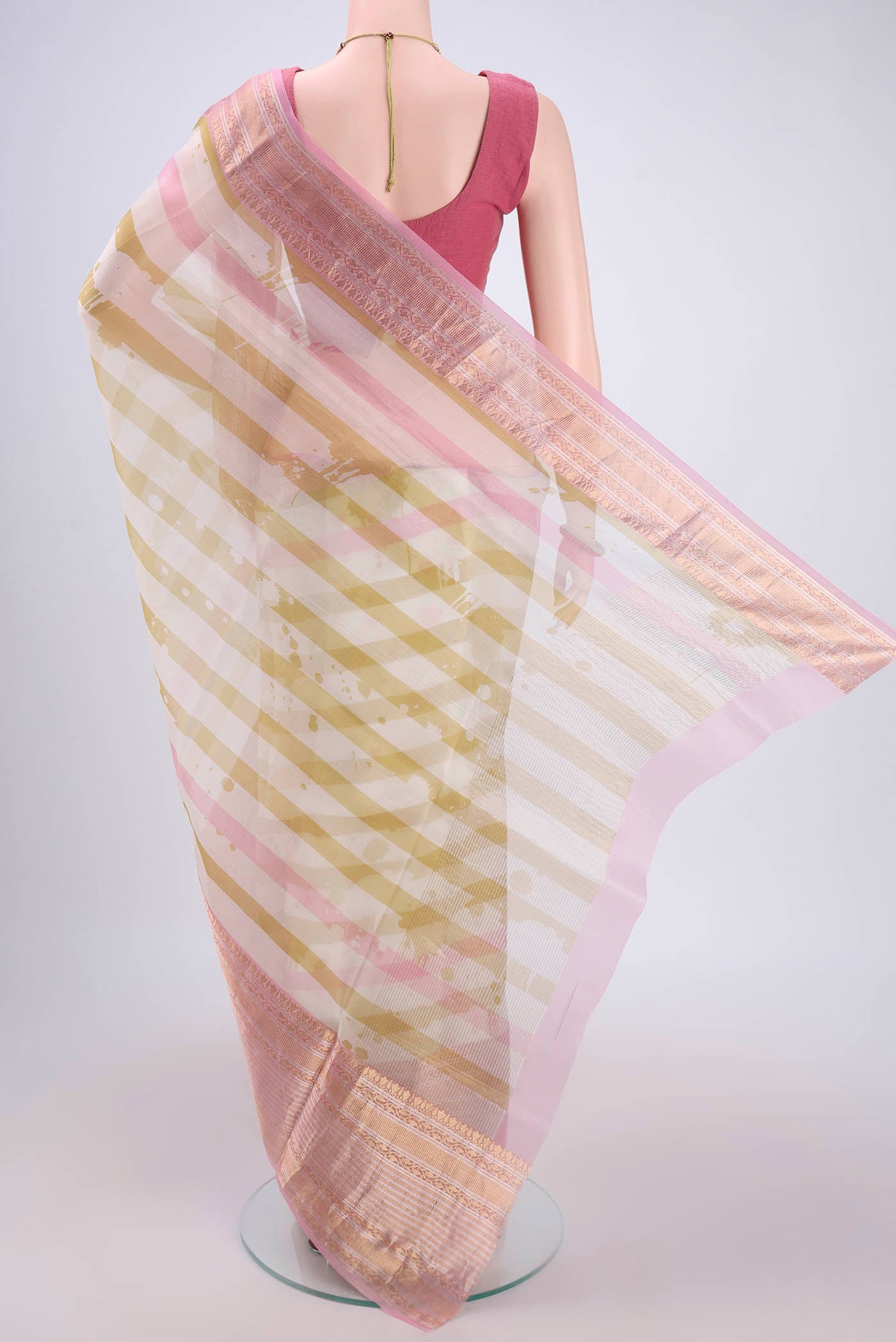 Flat view of Off White Organza Silk Saree with Stripes on the body and Zari Border. 