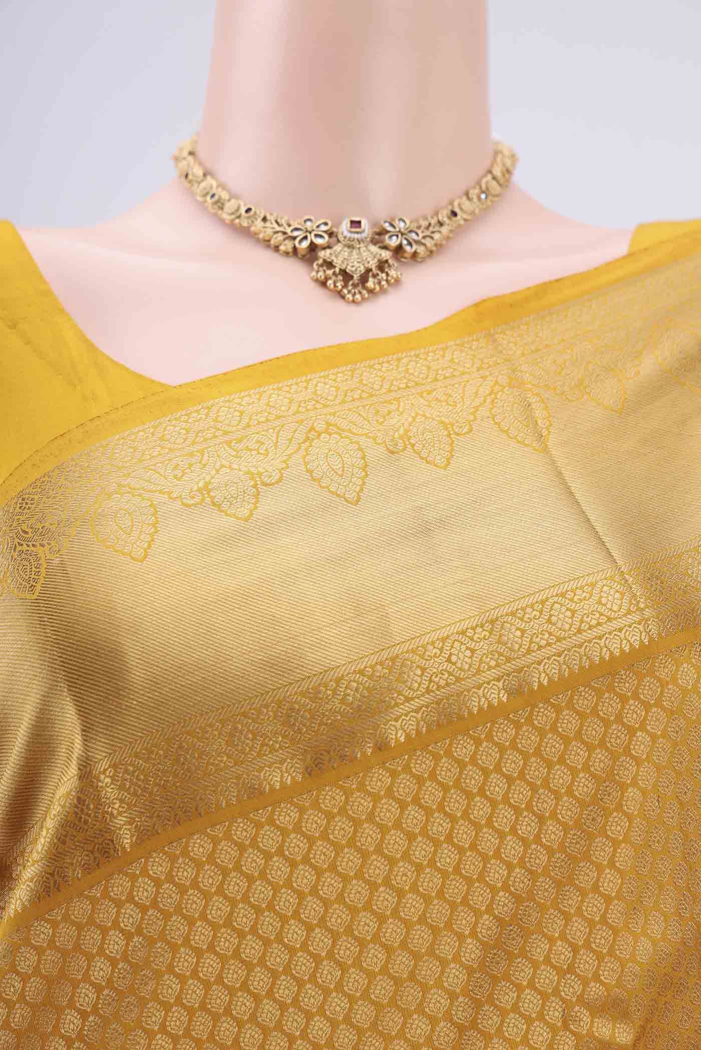 Border image of Yellow Bangalore Silk Saree with Zari Brocade on the body and Zari Border. 