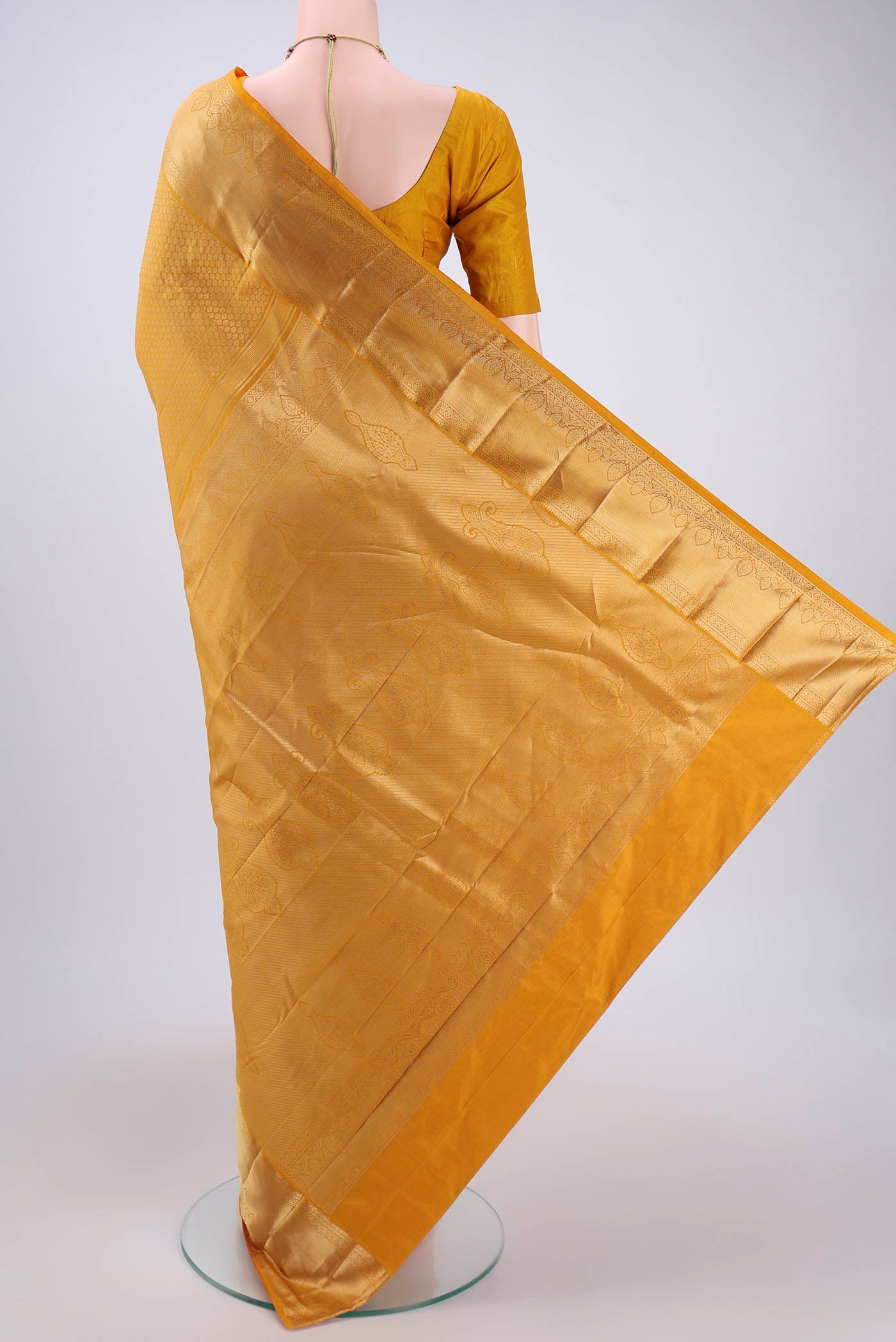 Flat view of Yellow Bangalore Silk Saree with Zari Brocade on the body and Zari Border. 