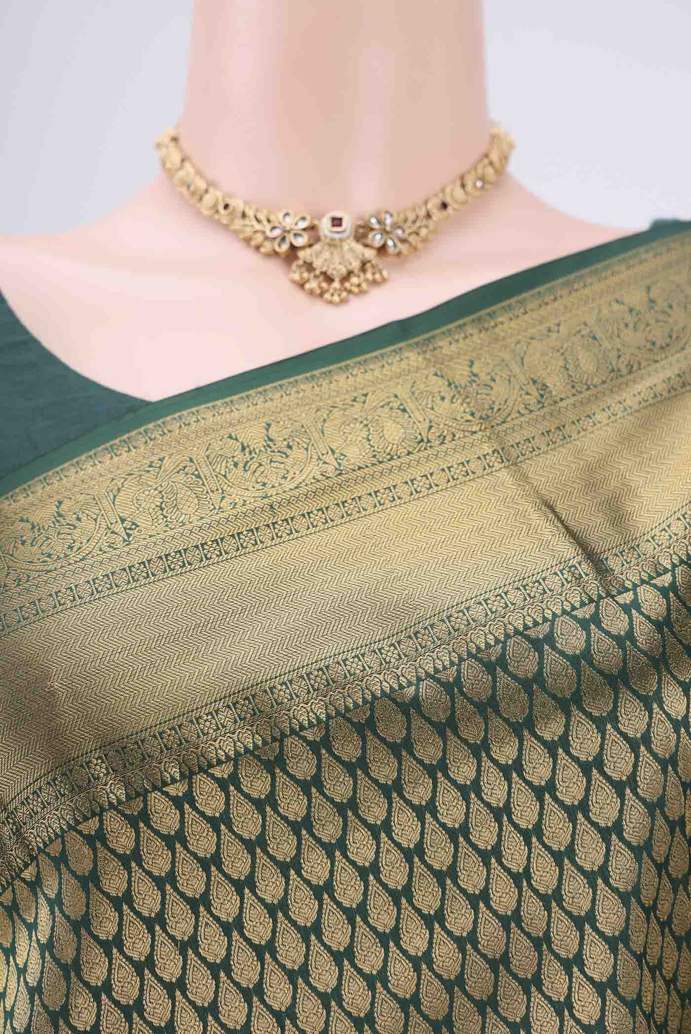 Border image of Bottle Green Bangalore Silk Saree with Zari Brocade on the body and Zari Border. 