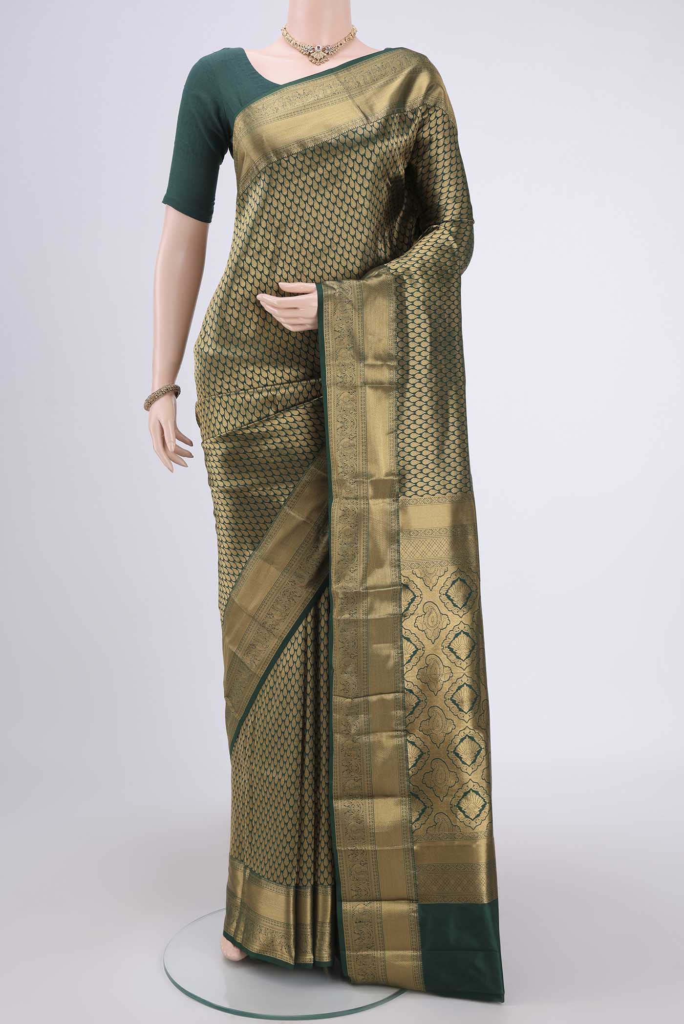 Bottle Green Bangalore Silk Saree with Zari Brocade on the body and Zari Border.  displayed on a mannequin