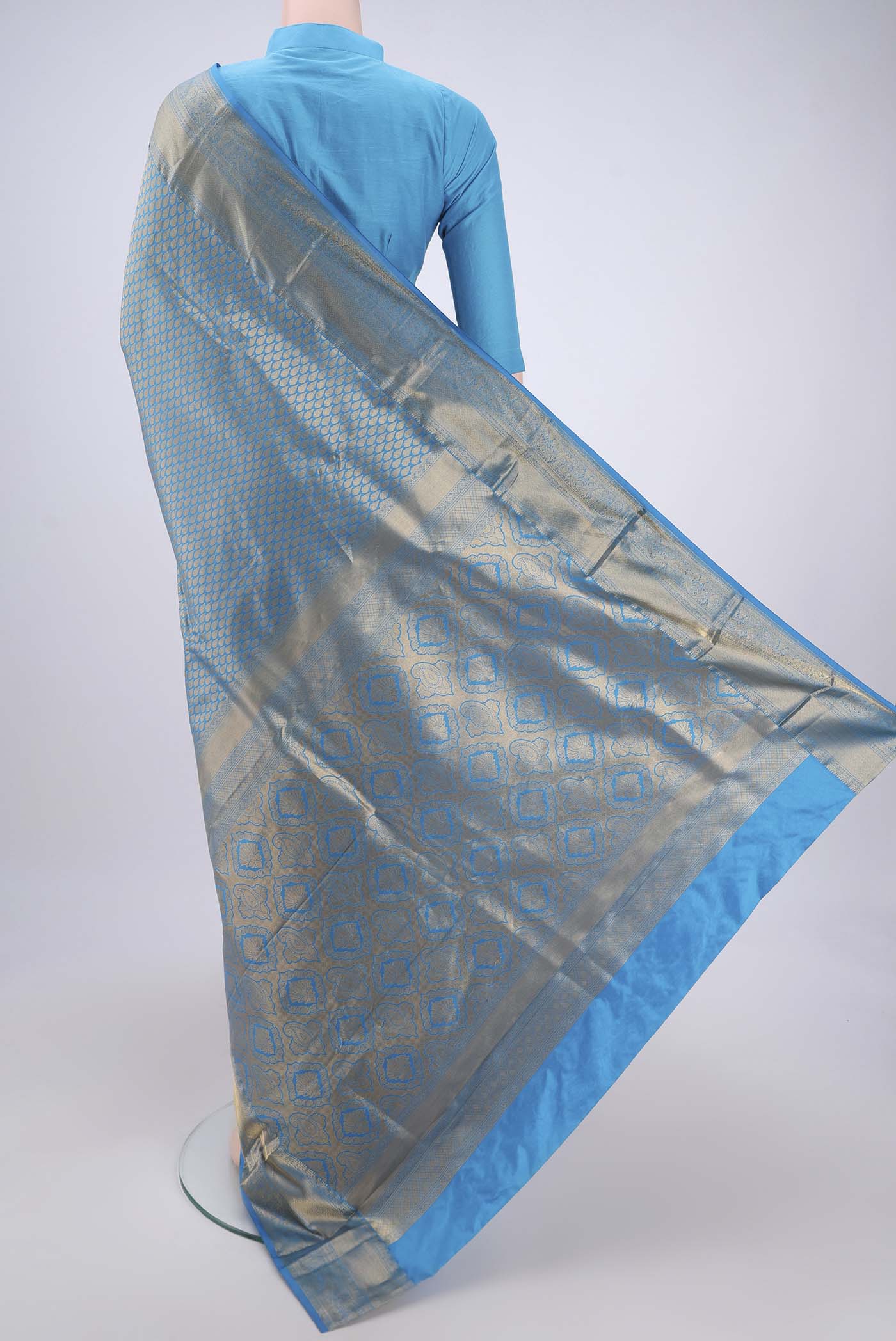Flat view of Blue Bangalore Silk Saree with Zari Brocade on the body and Zari Border. 