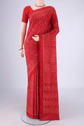 Deep Red Rajkot Patola Silk Saree with Pure Ikat on the body and Ikat Border.  displayed on a mannequin