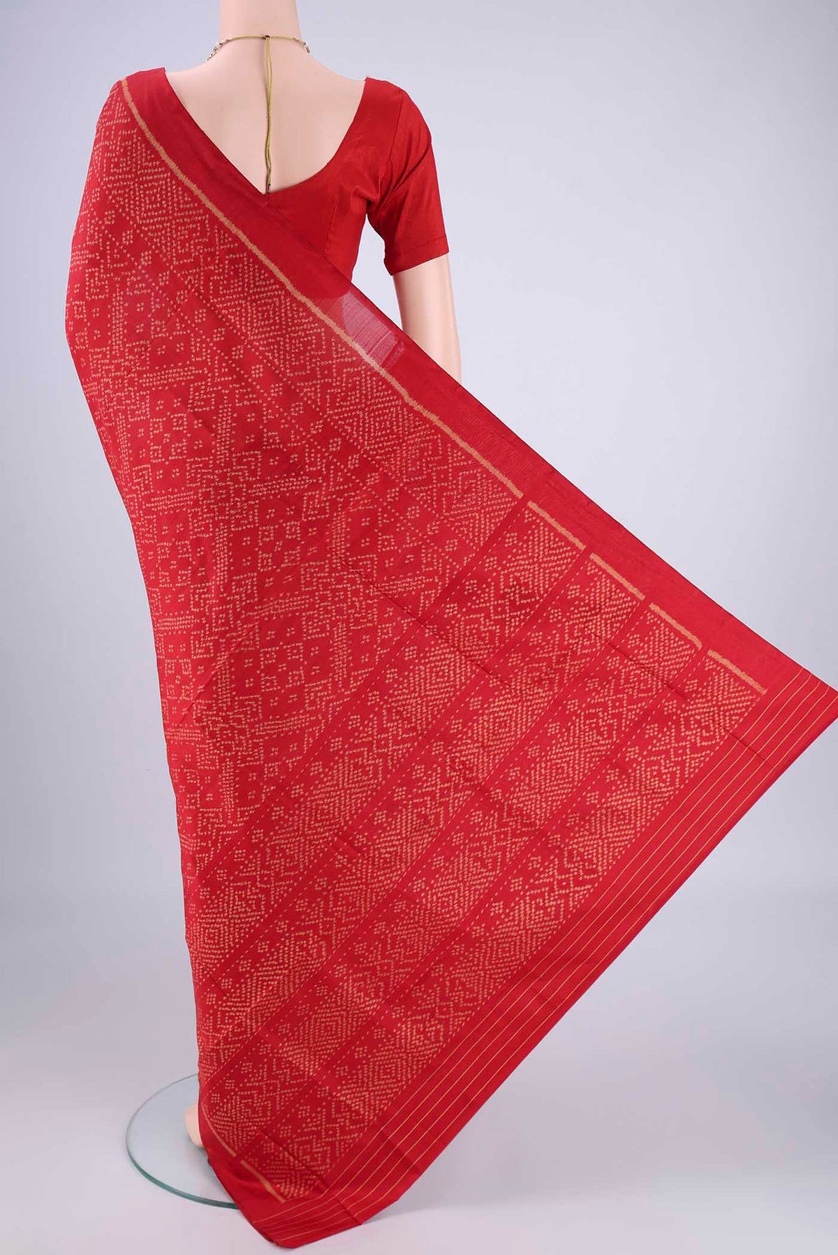 Flat view of Deep Red Rajkot Patola Silk Saree with Pure Ikat on the body and Ikat Border. 