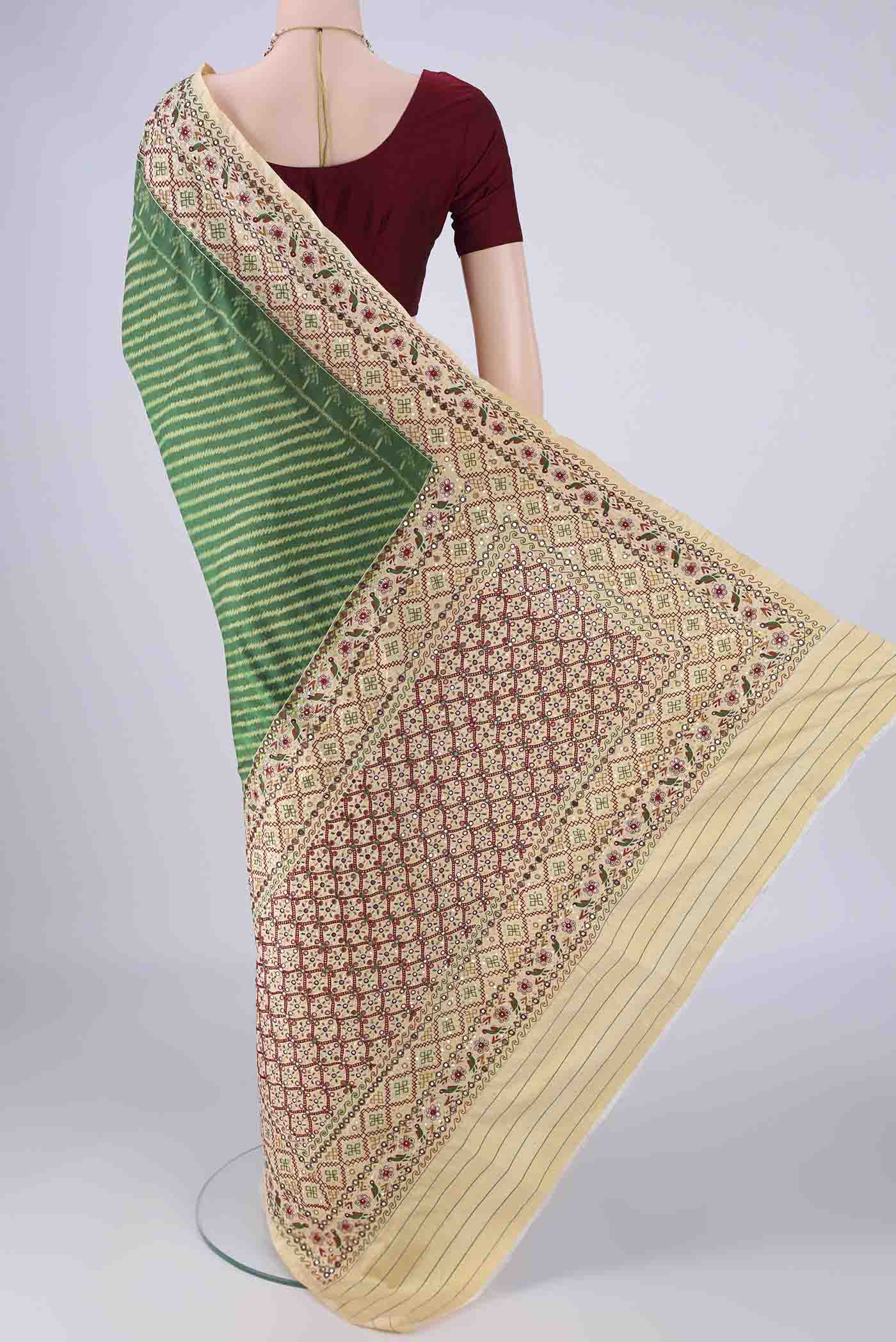 Flat view of Green Kanchipuram Silk Saree with Pure Ikat on the body and Embroidery Border. 
