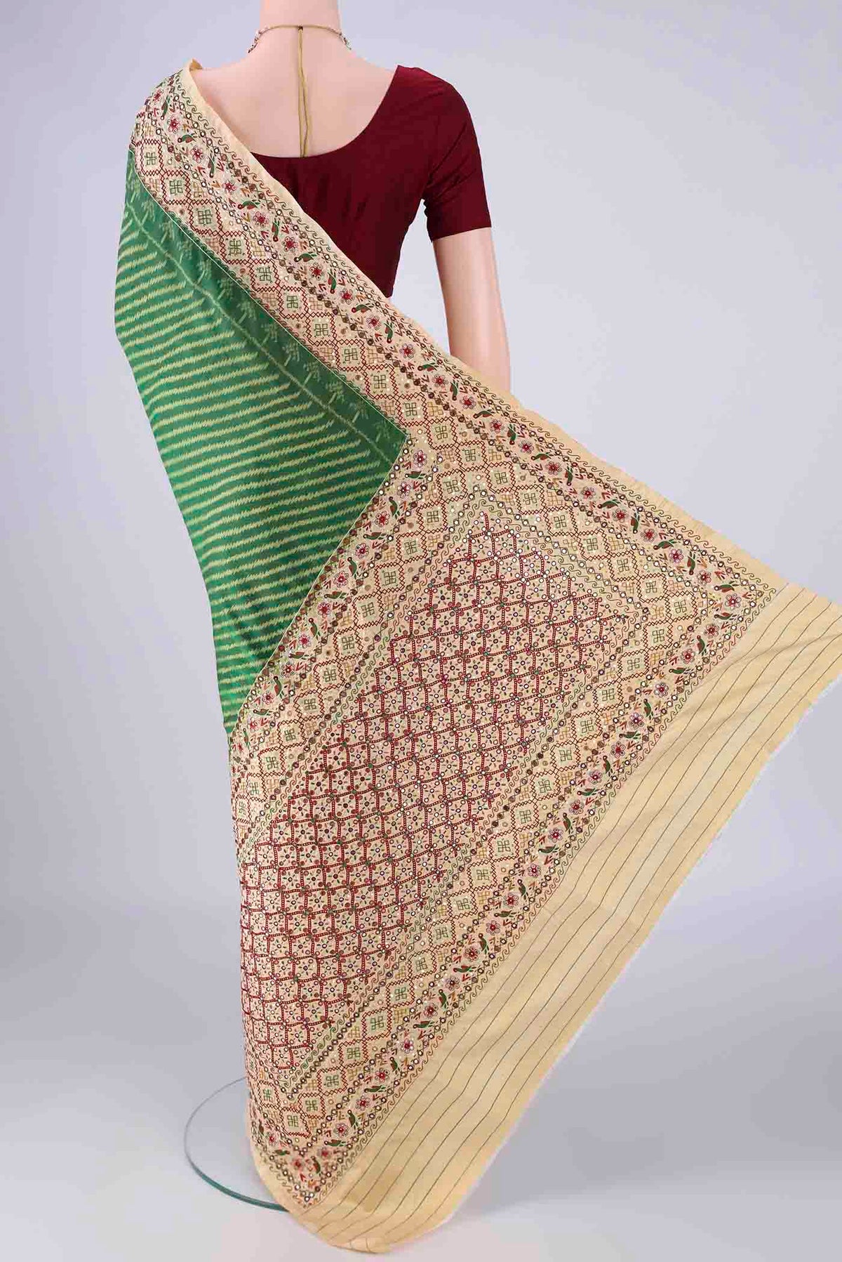 Flat view of Green Kanchipuram Silk Saree with Pure Ikat on the body and Embroidery Border. 